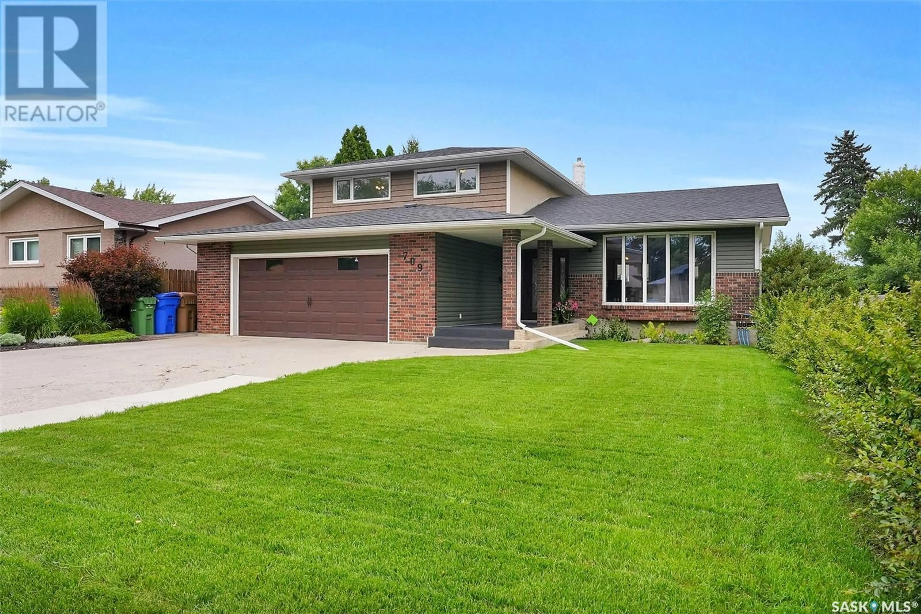 Home with brick exterior material, street for 709 DALGLIESH DRIVE, Regina Saskatchewan S4R6R1