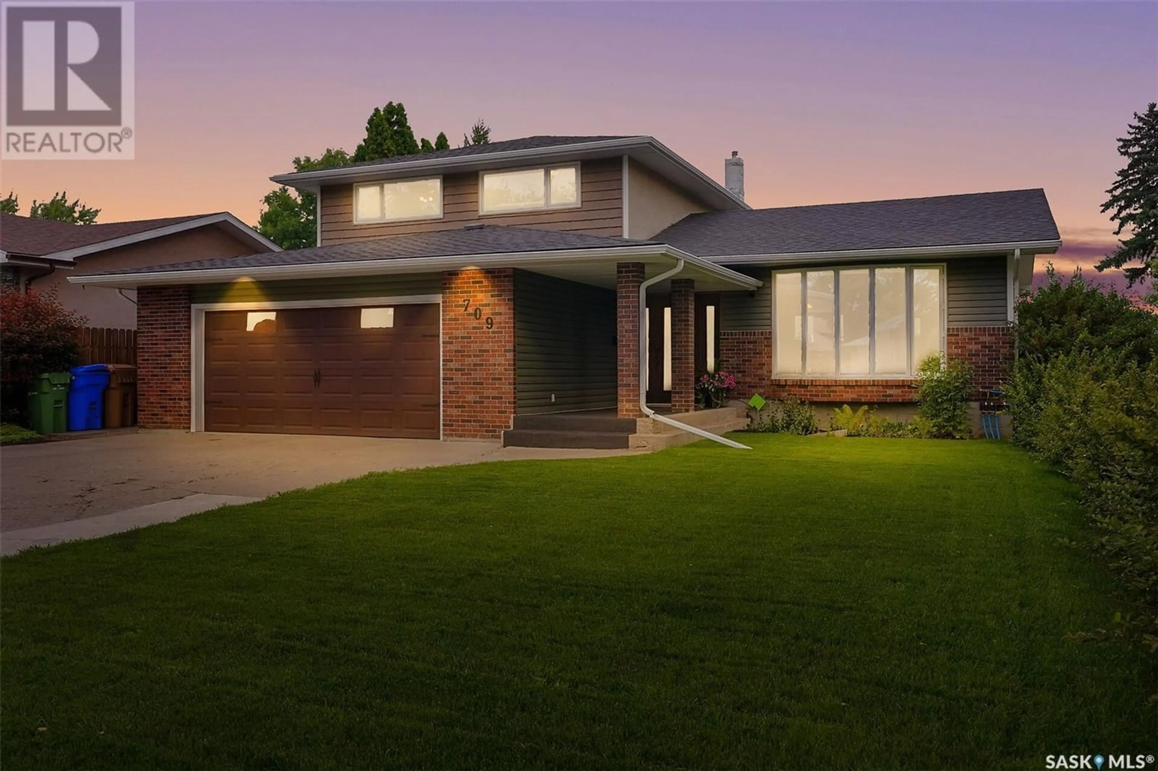 Home with brick exterior material, street for 709 DALGLIESH DRIVE, Regina Saskatchewan S4R6R1