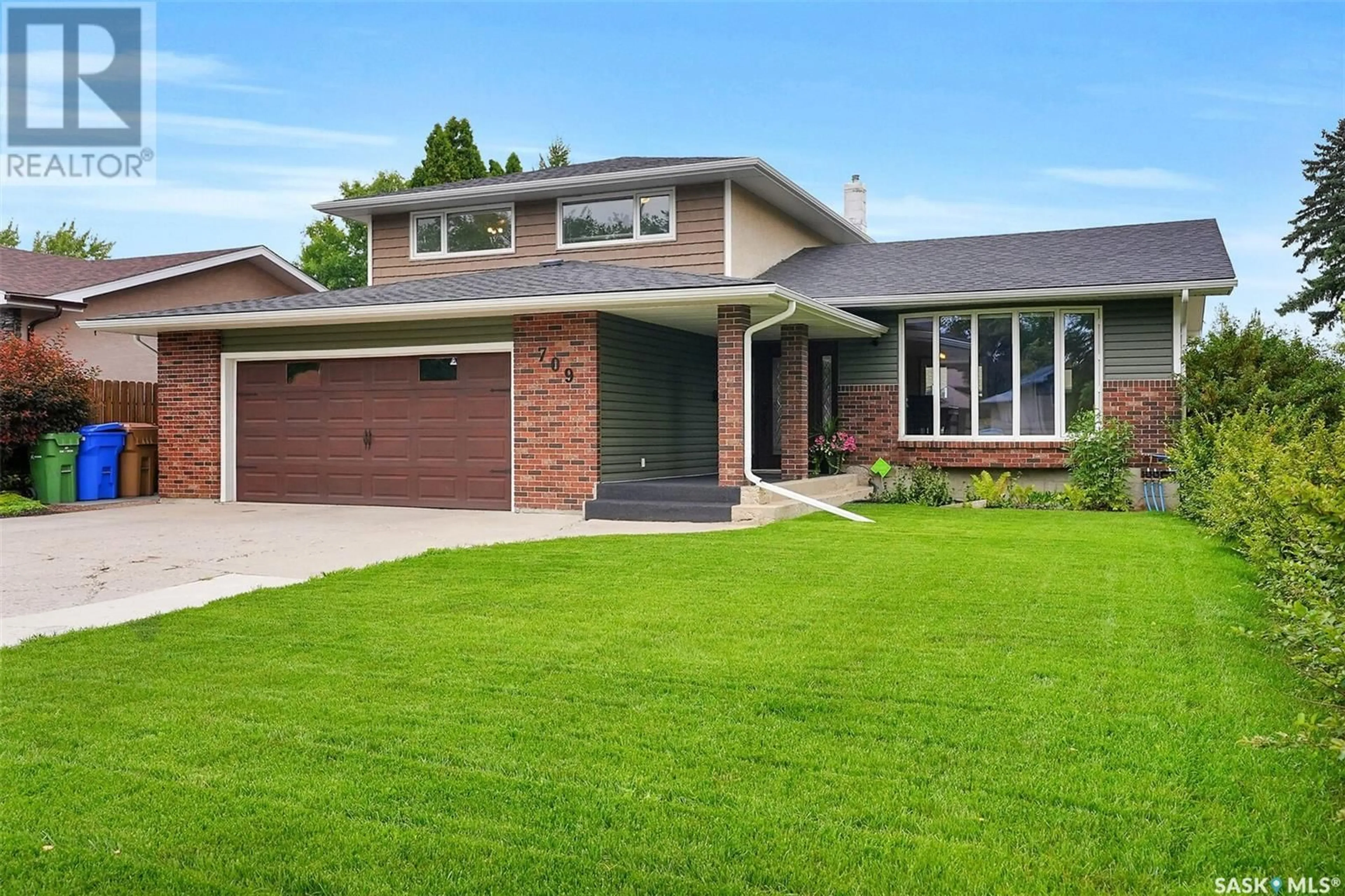 Home with brick exterior material, street for 709 DALGLIESH DRIVE, Regina Saskatchewan S4R6R1