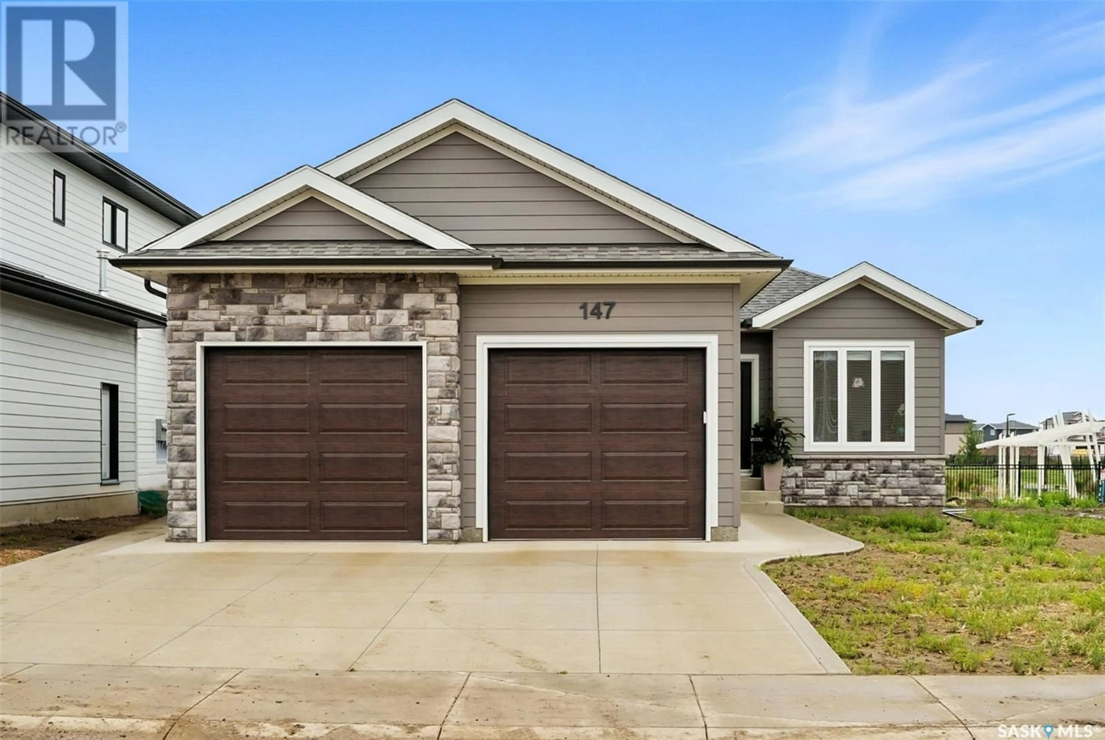 Home with brick exterior material, street for 147 KATZ AVENUE, Saskatoon Saskatchewan S7V1S8