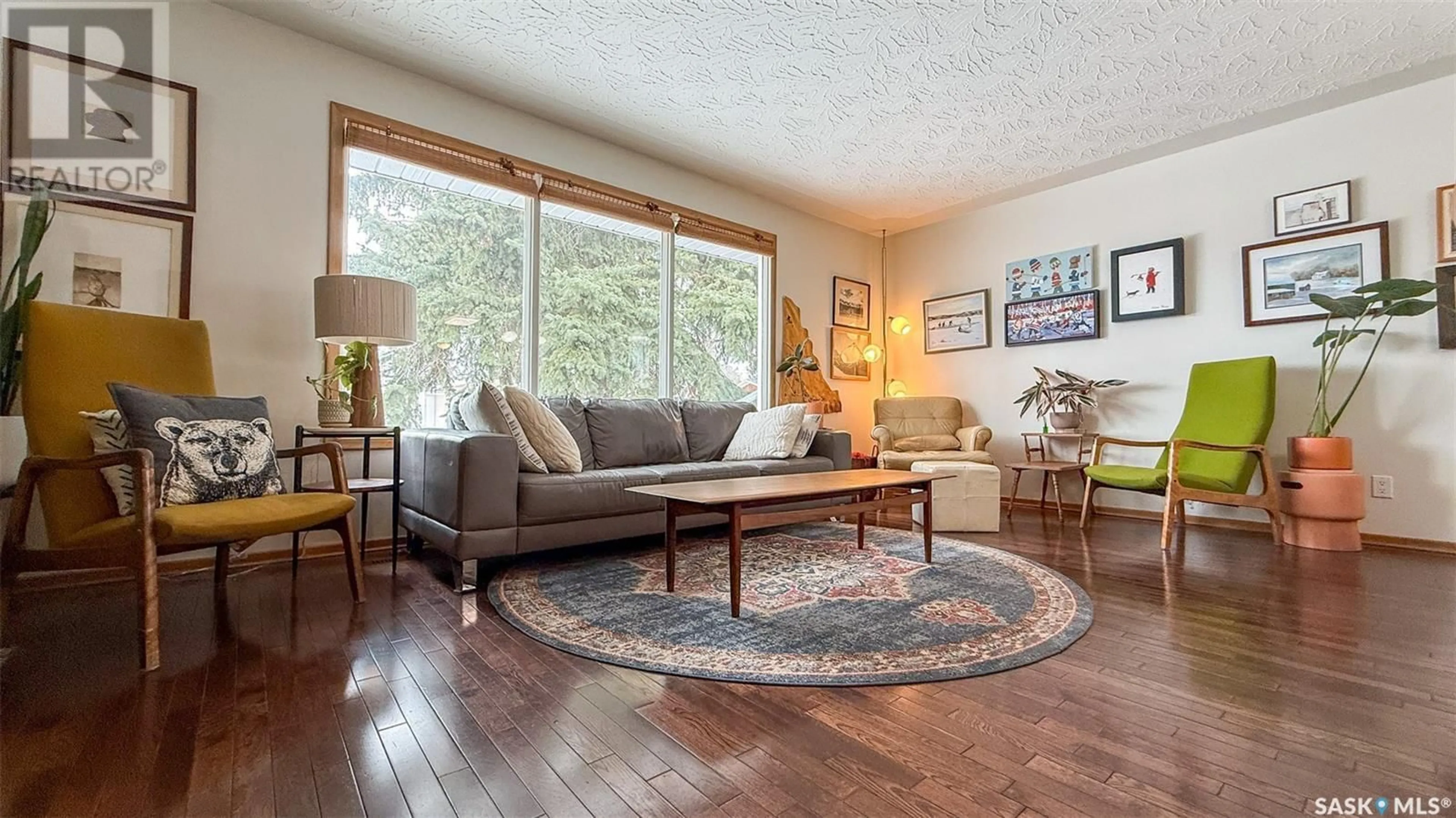 Living room with furniture, wood/laminate floor for 3922 ATHOL STREET, Regina Saskatchewan S4S3J3