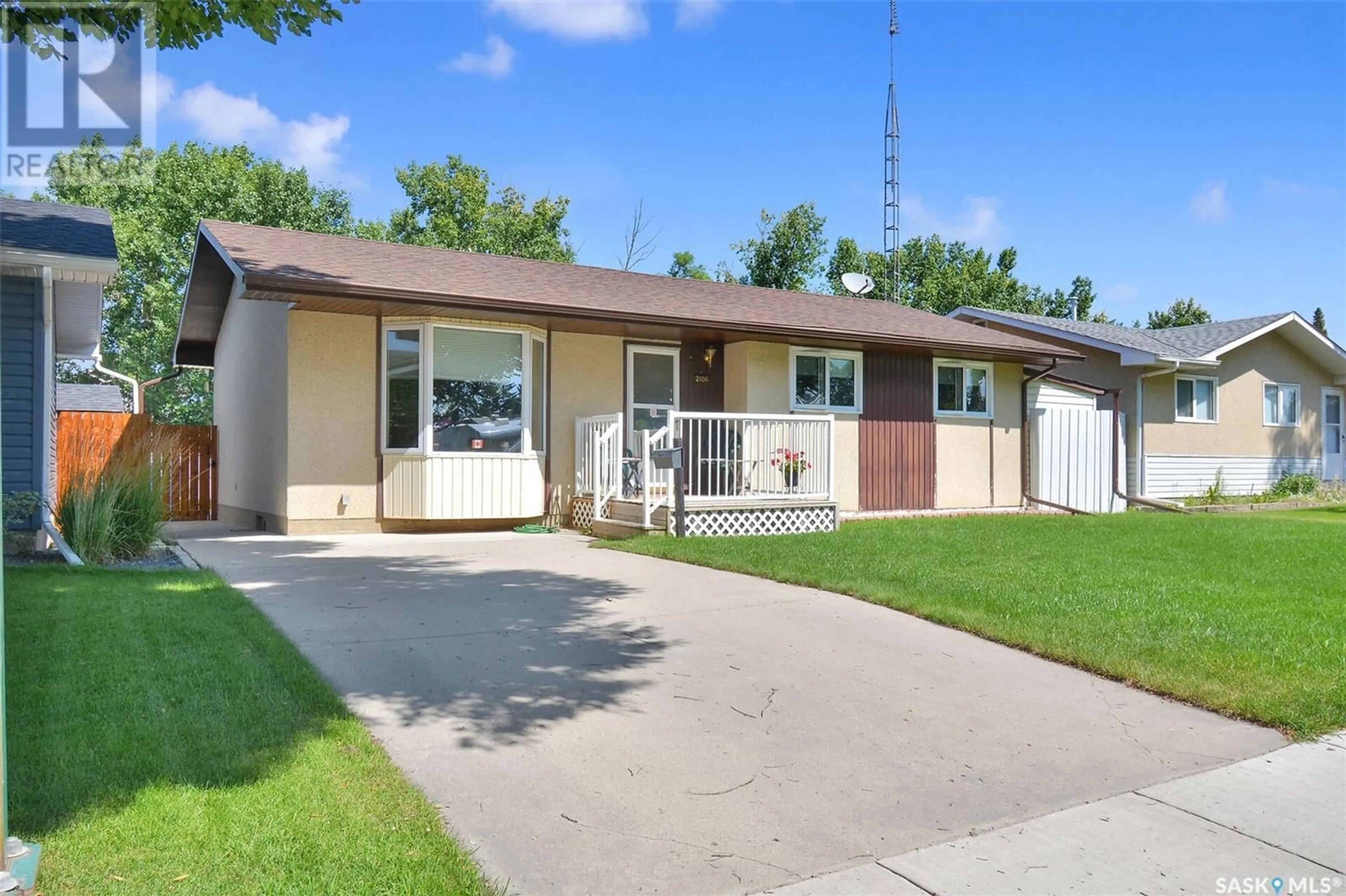 Home with vinyl exterior material, street for 2106 37TH STREET, Saskatoon Saskatchewan S7L4S3
