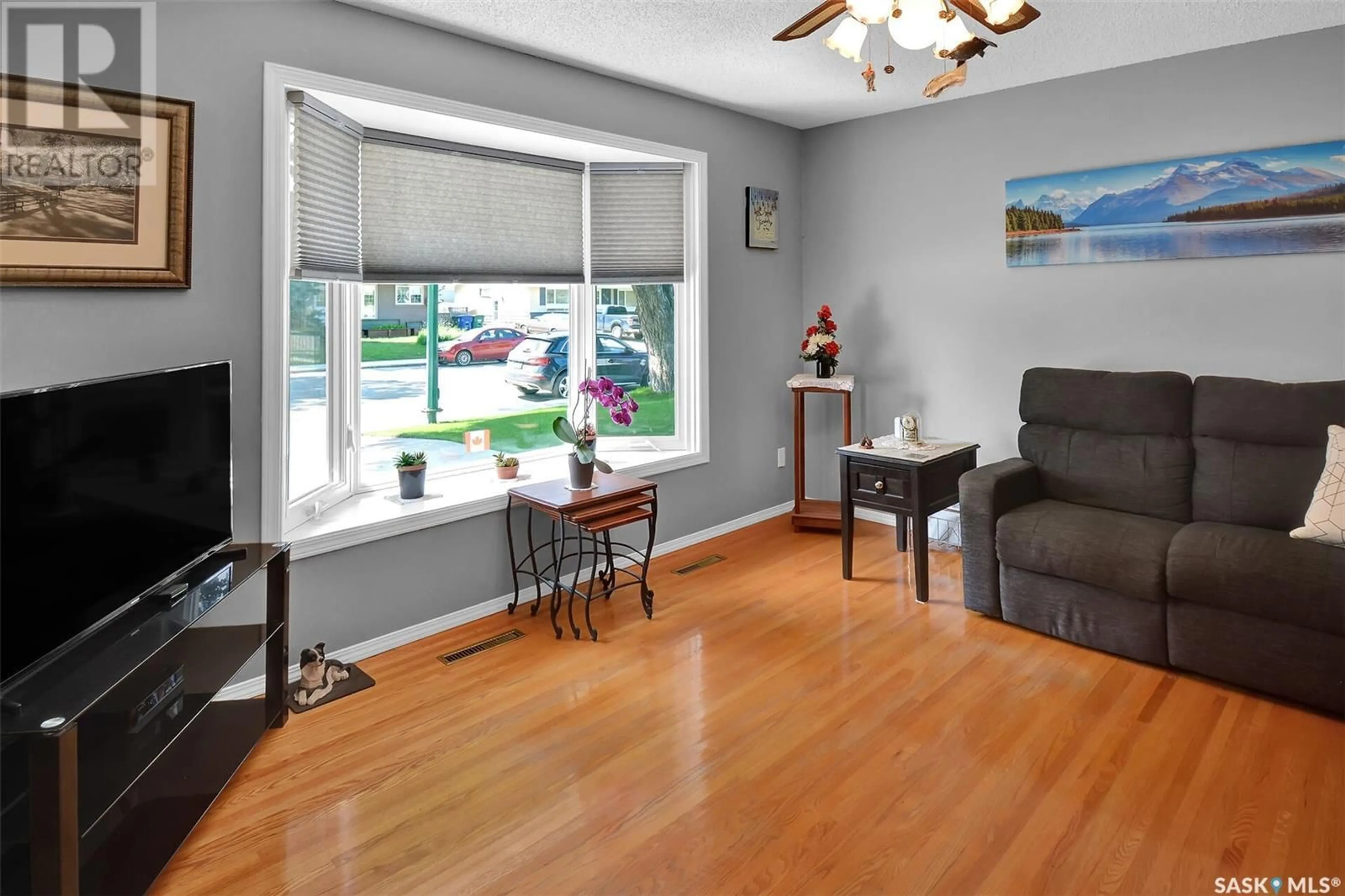 Living room with furniture, wood/laminate floor for 2106 37TH STREET, Saskatoon Saskatchewan S7L4S3