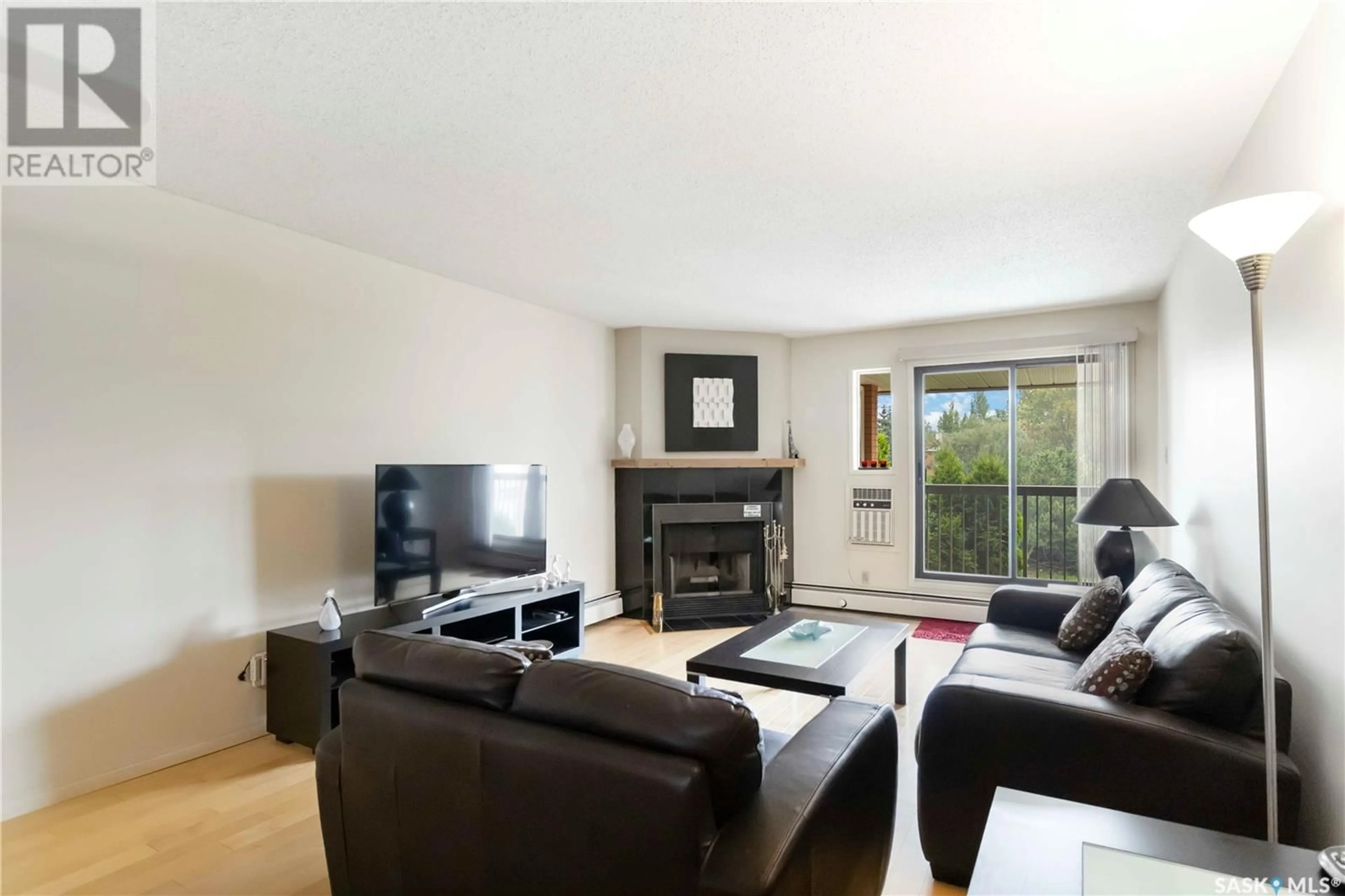 Living room with furniture, wood/laminate floor for 209A - 308 CREE PLACE, Saskatoon Saskatchewan S7K7Z3