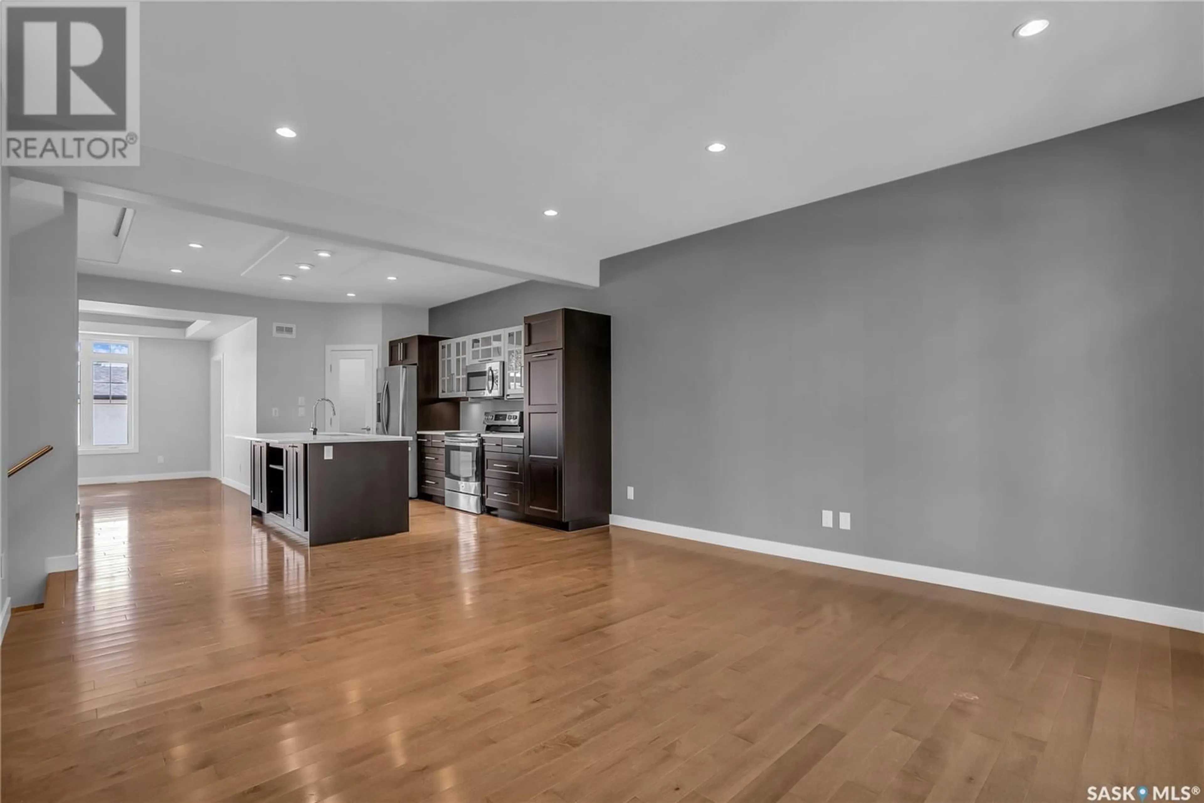 Open concept kitchen, wood/laminate floor for 1108 9TH STREET, Saskatoon Saskatchewan S7H0N5