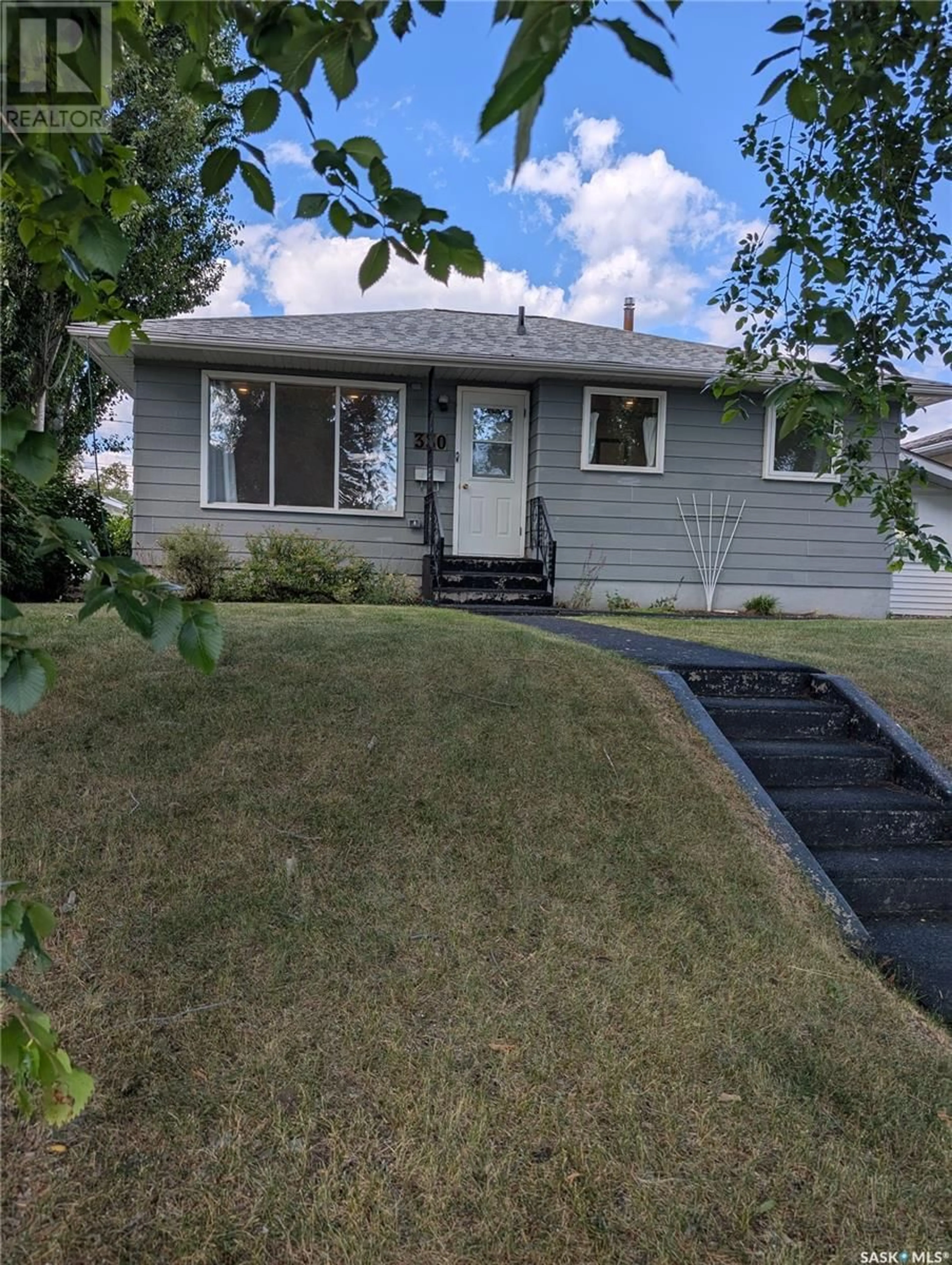 Home with vinyl exterior material, street for 330 25TH STREET, Prince Albert Saskatchewan S6V1T1