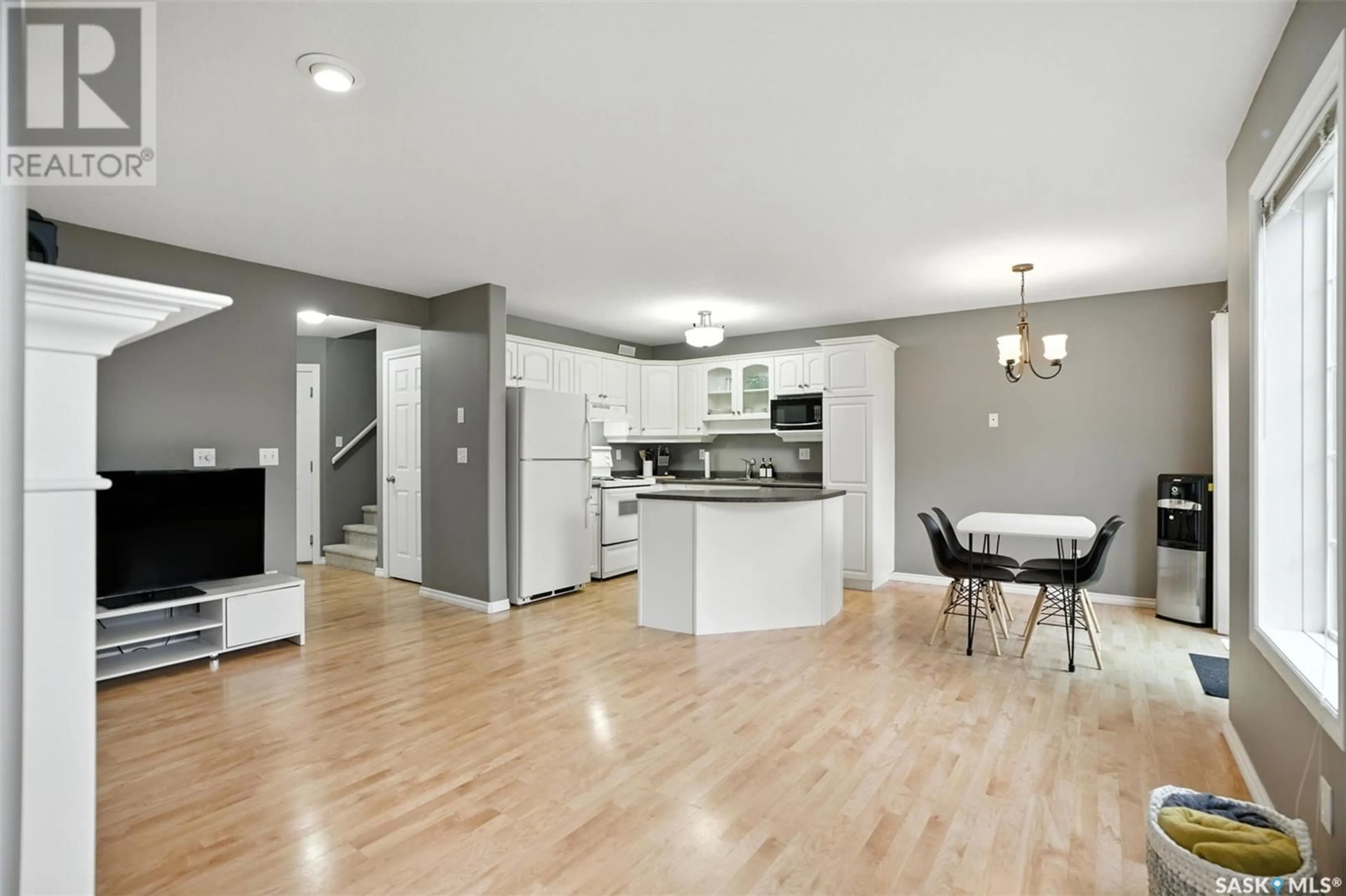 Open concept kitchen, wood/laminate floor for 28 110 BANYAN CRESCENT, Saskatoon Saskatchewan S7V1G7