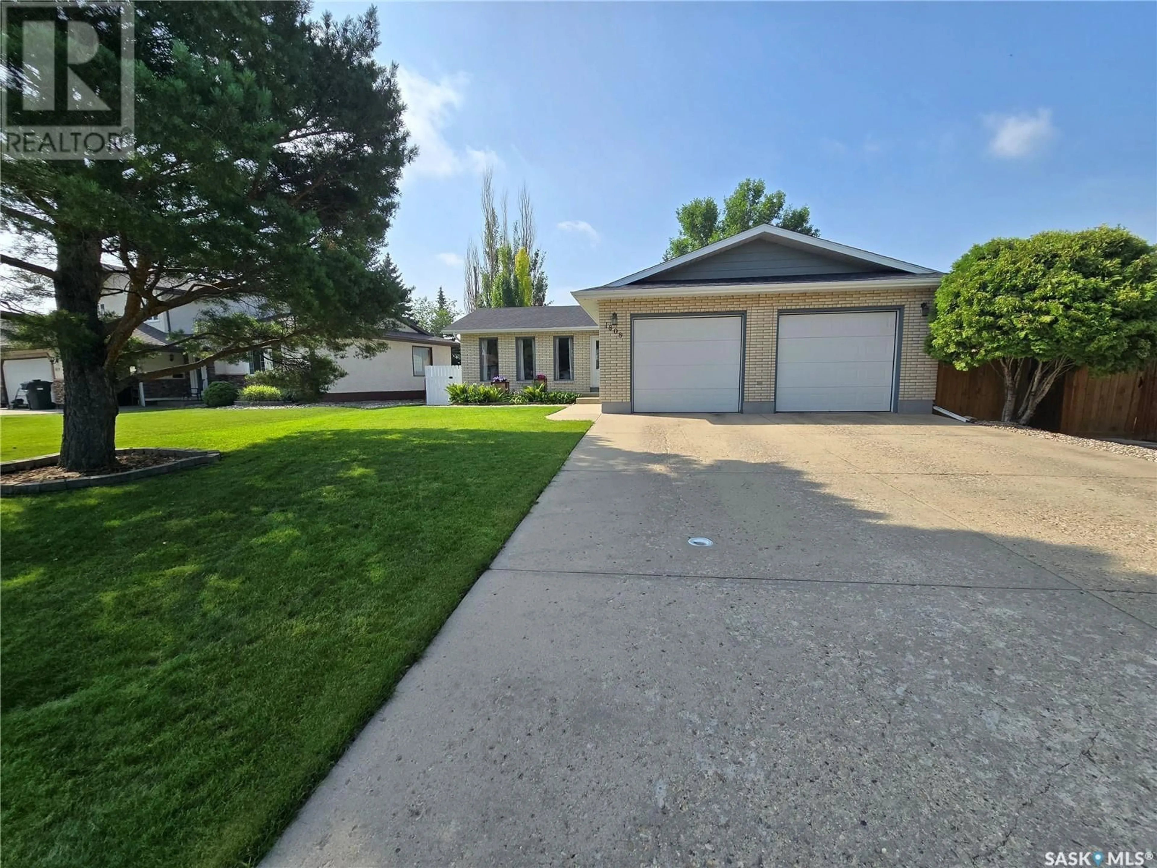 A pic from outside/outdoor area/front of a property/back of a property/a pic from drone, street for 1808 WARREN AVENUE, Weyburn Saskatchewan S4H3B6
