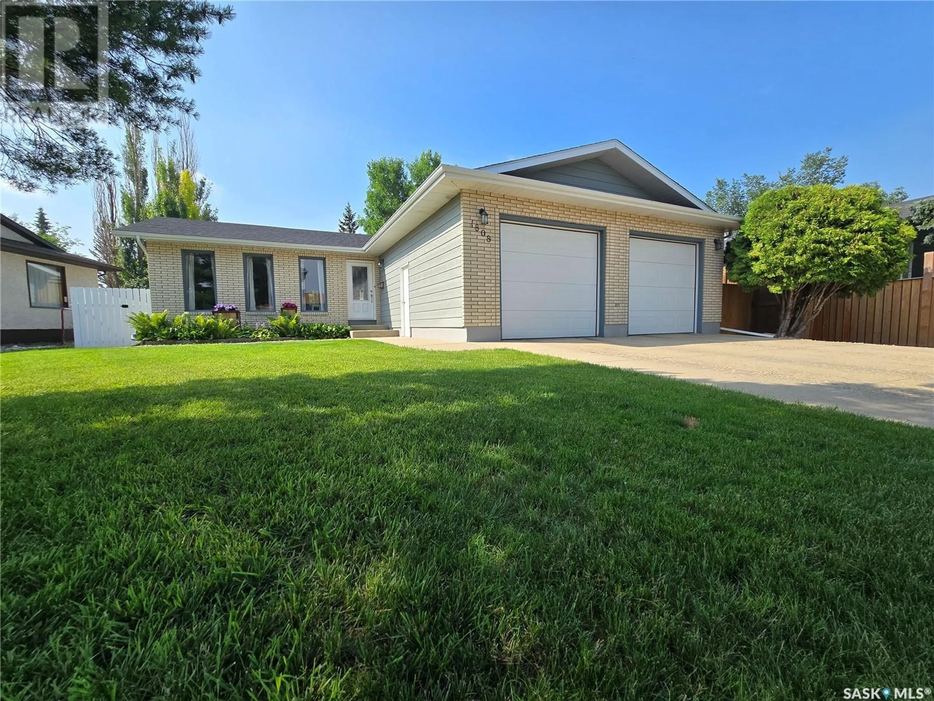 Home with vinyl exterior material, street for 1808 WARREN AVENUE, Weyburn Saskatchewan S4H3B6