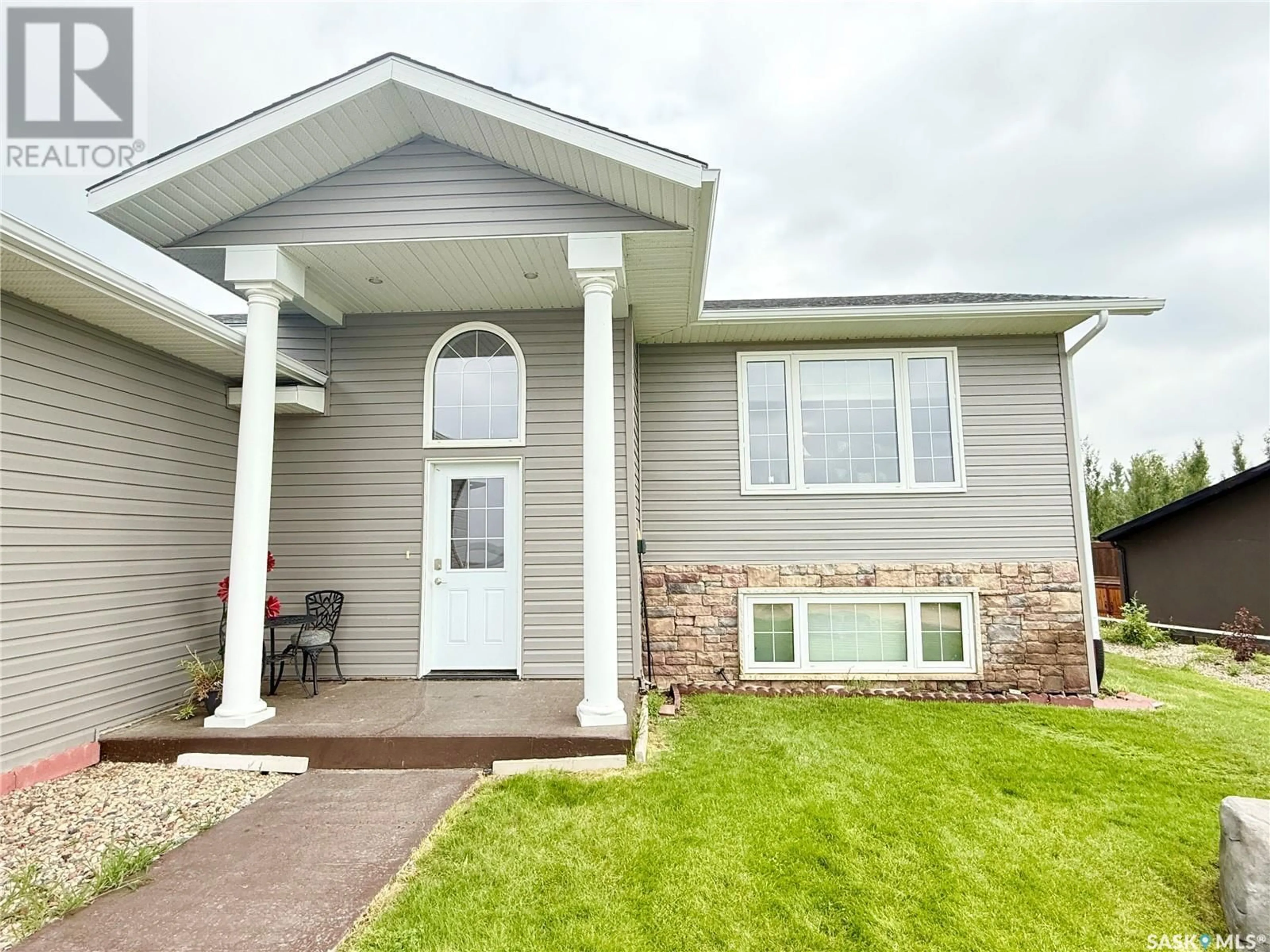 Home with vinyl exterior material, street for 4 ISLAND VIEW, Cymri Rm No. 36 Saskatchewan S0C1S0
