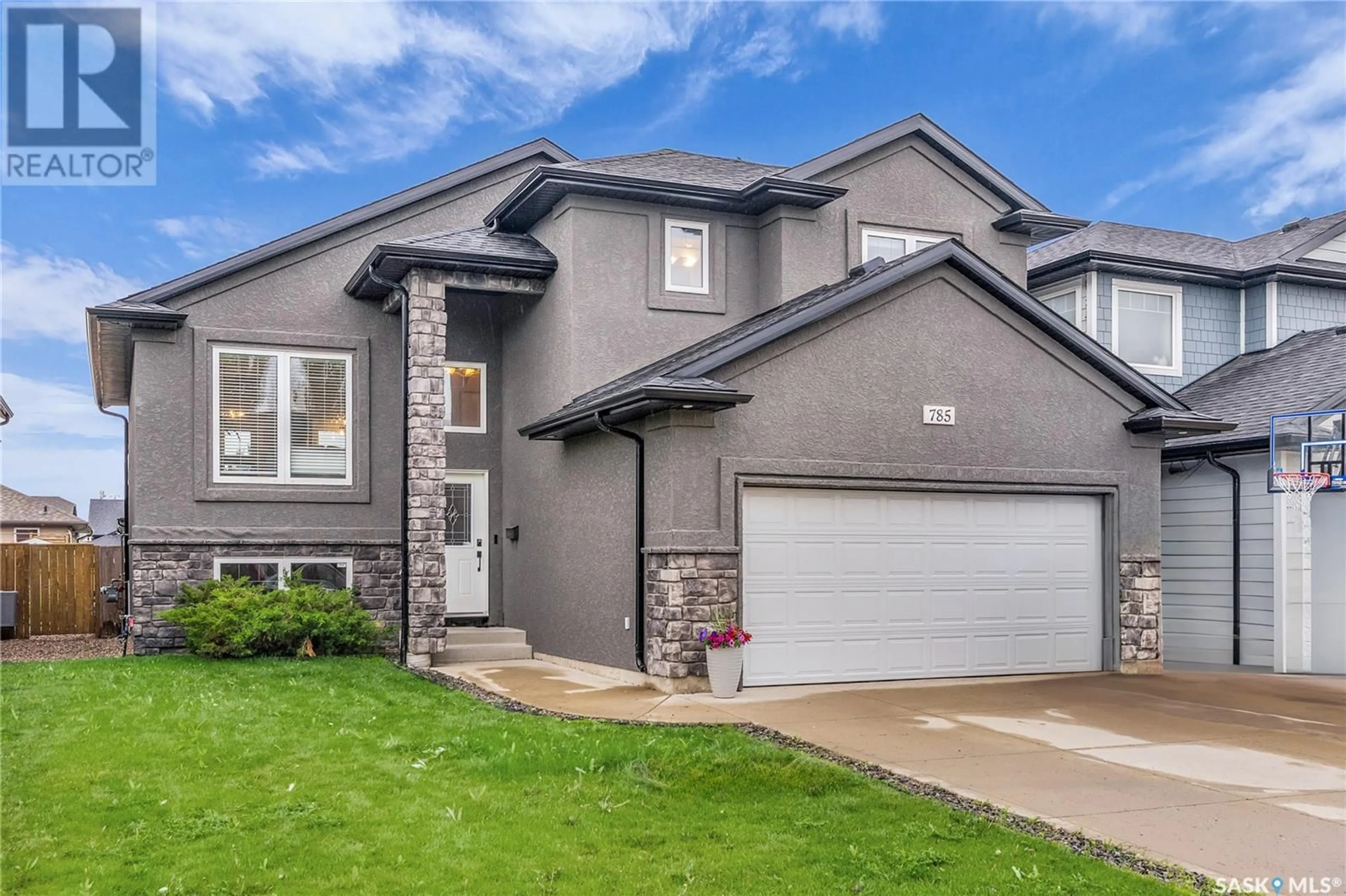Home with vinyl exterior material, street for 785 REMPEL COVE, Saskatoon Saskatchewan S7T0M4