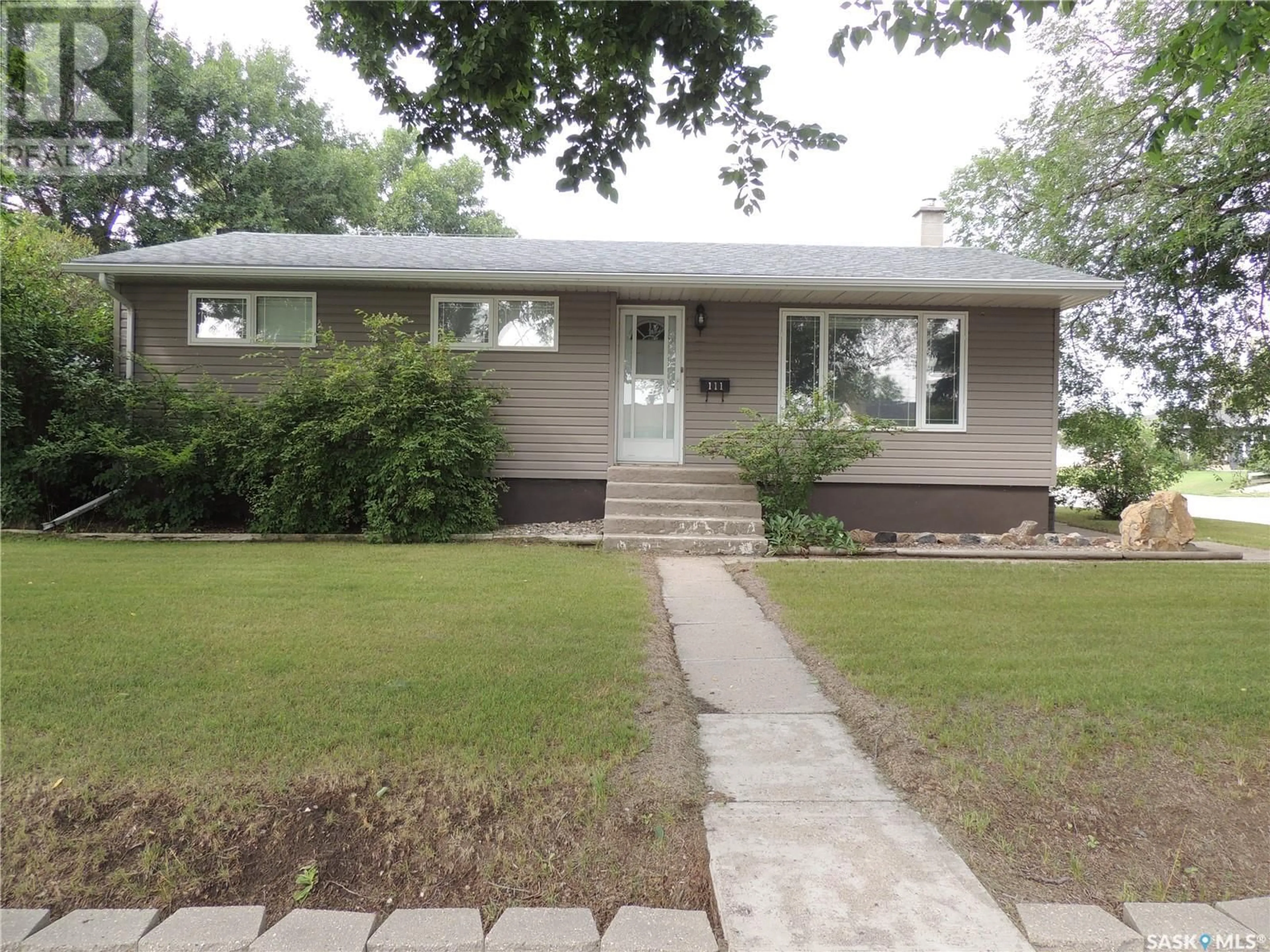 Home with vinyl exterior material, street for 111 MCDONALD ROAD, Estevan Saskatchewan S4A0B7