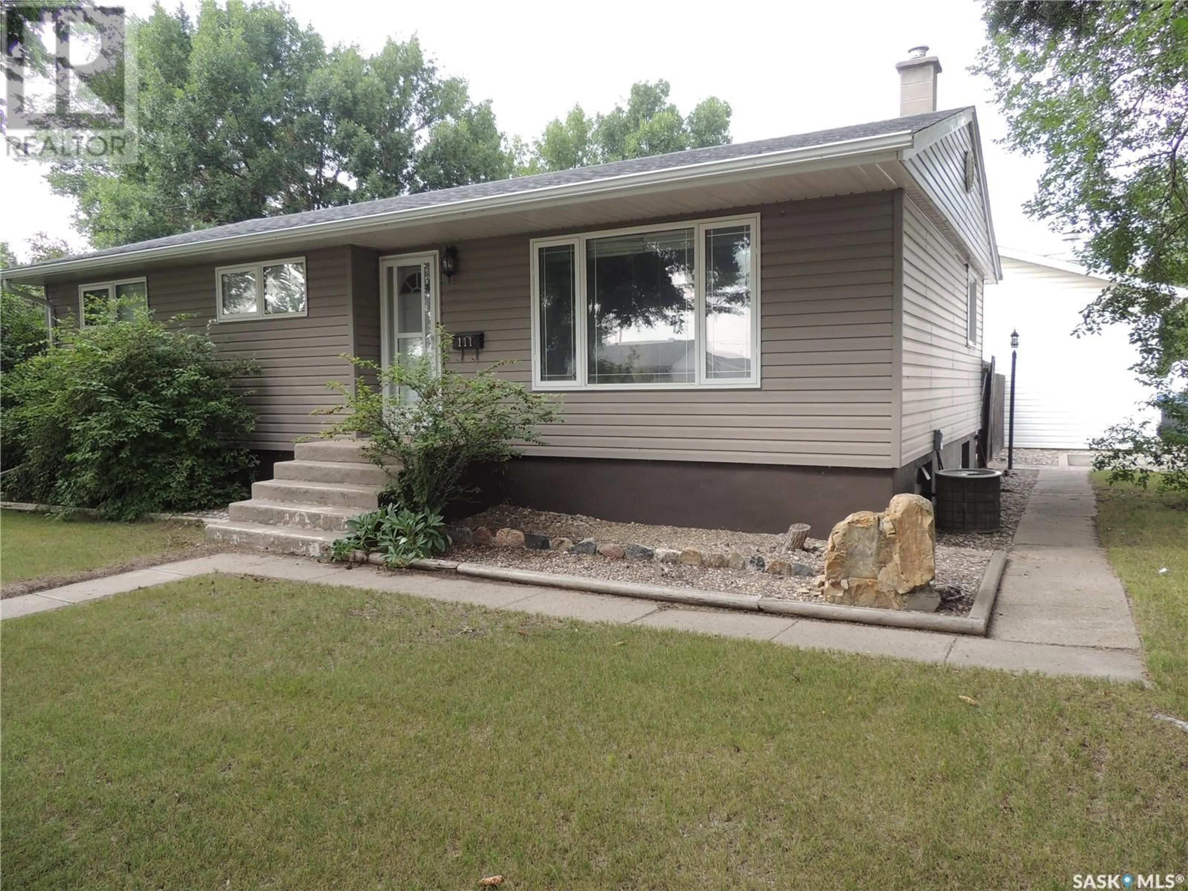 Home with vinyl exterior material, street for 111 MCDONALD ROAD, Estevan Saskatchewan S4A0B7