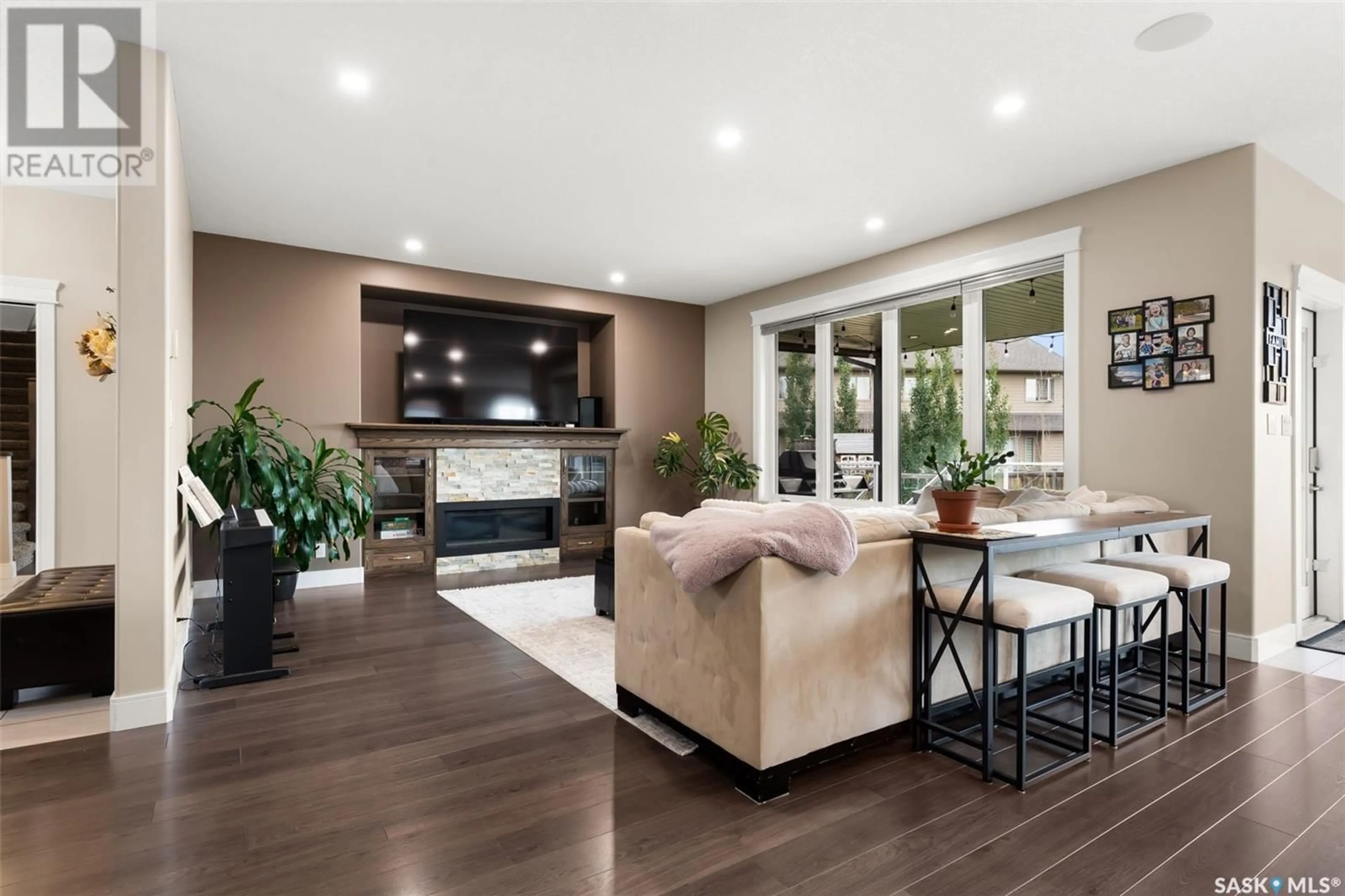 Living room with furniture, wood/laminate floor for 3841 GOLDFINCH WAY, Regina Saskatchewan S4V1S4