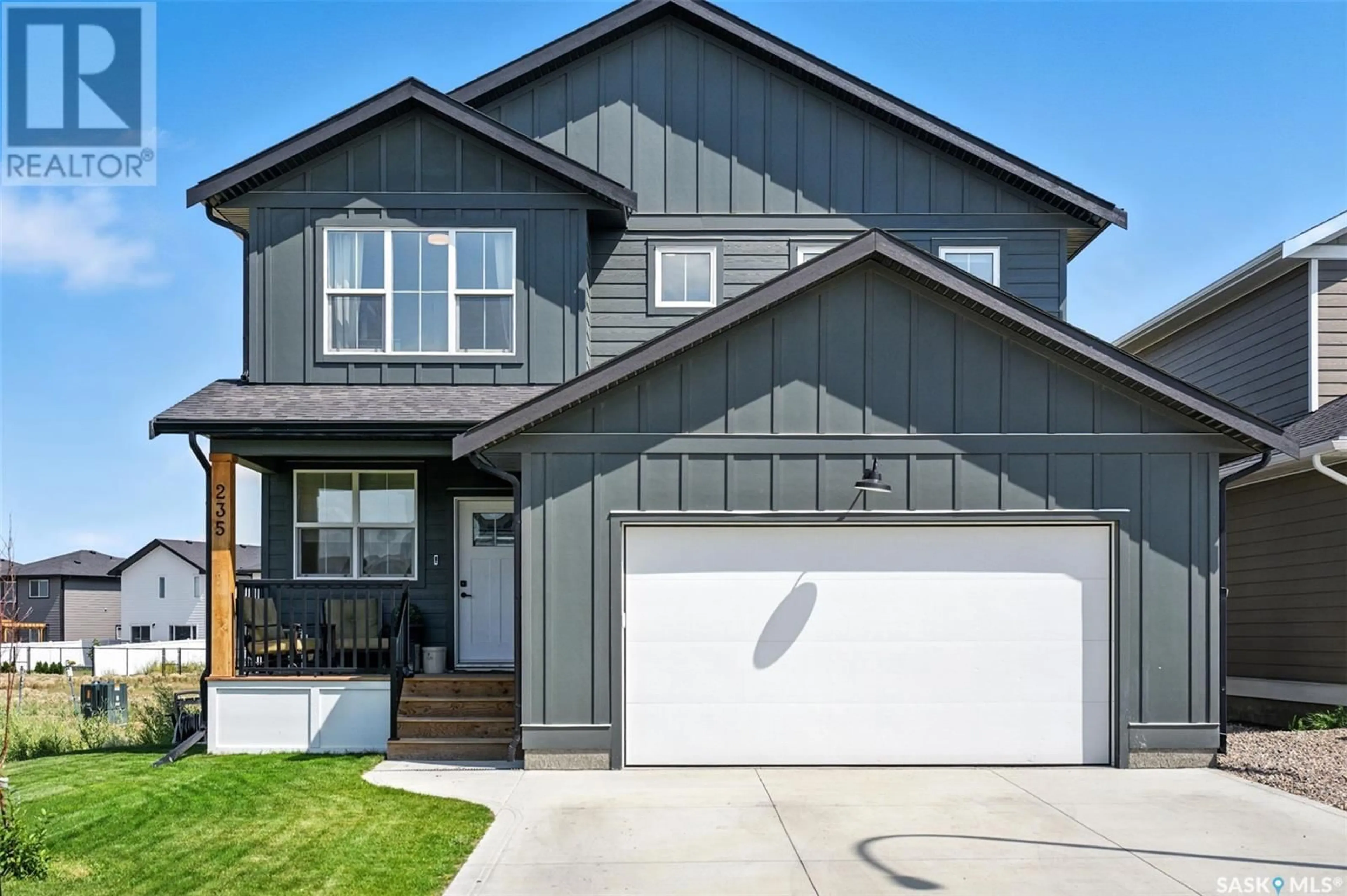 Home with vinyl exterior material, street for 235 DZIADYK MANOR, Saskatoon Saskatchewan S7V1M5