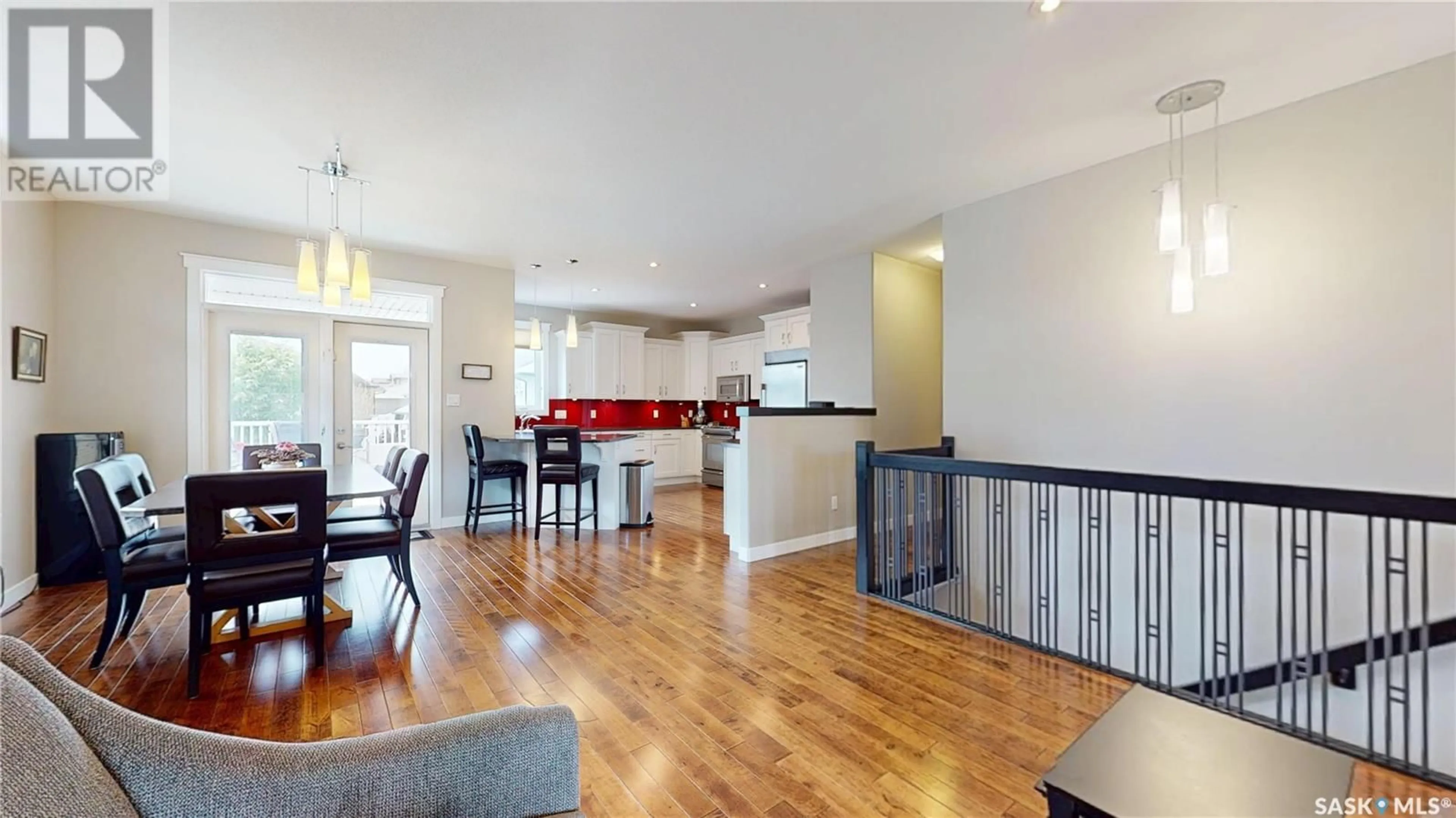 Open concept kitchen, wood/laminate floor for 1806 BLAKE ROAD, Regina Saskatchewan S4X0G5