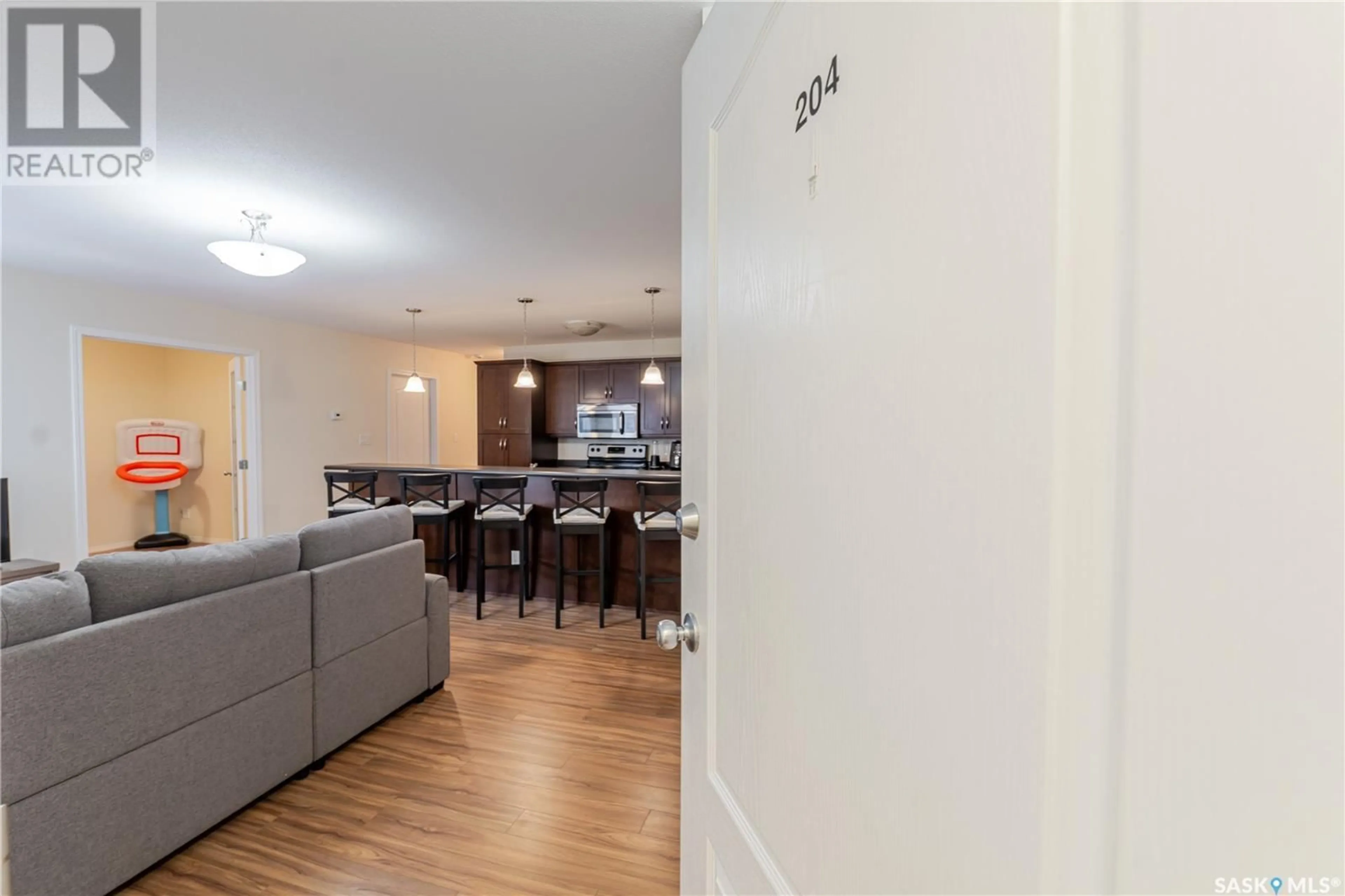 Open concept kitchen, wood/laminate floor for S - 204 221 MAIN STREET, Moose Jaw Saskatchewan S6H2R4
