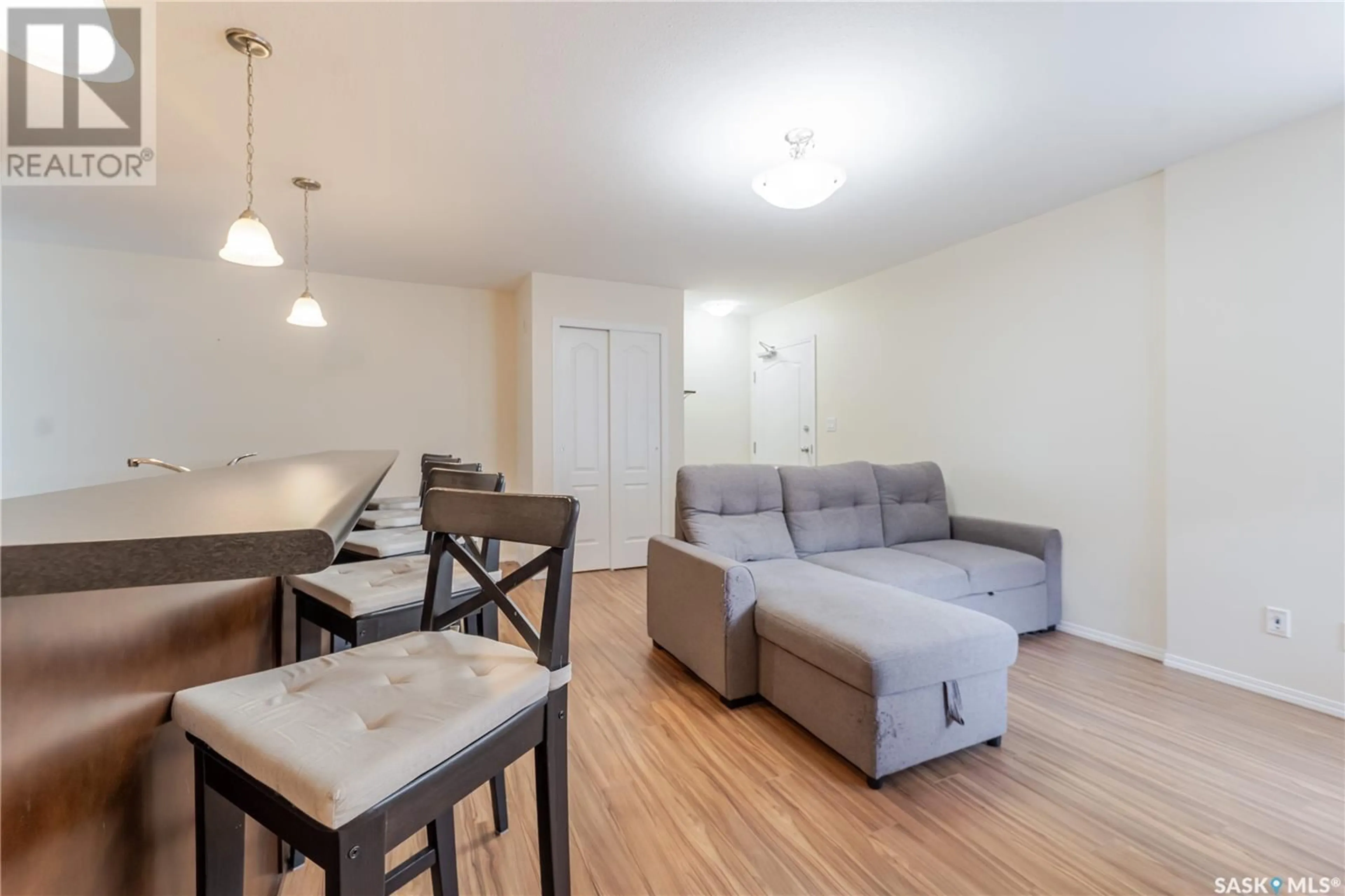 Living room with furniture, wood/laminate floor for S - 204 221 MAIN STREET, Moose Jaw Saskatchewan S6H2R4