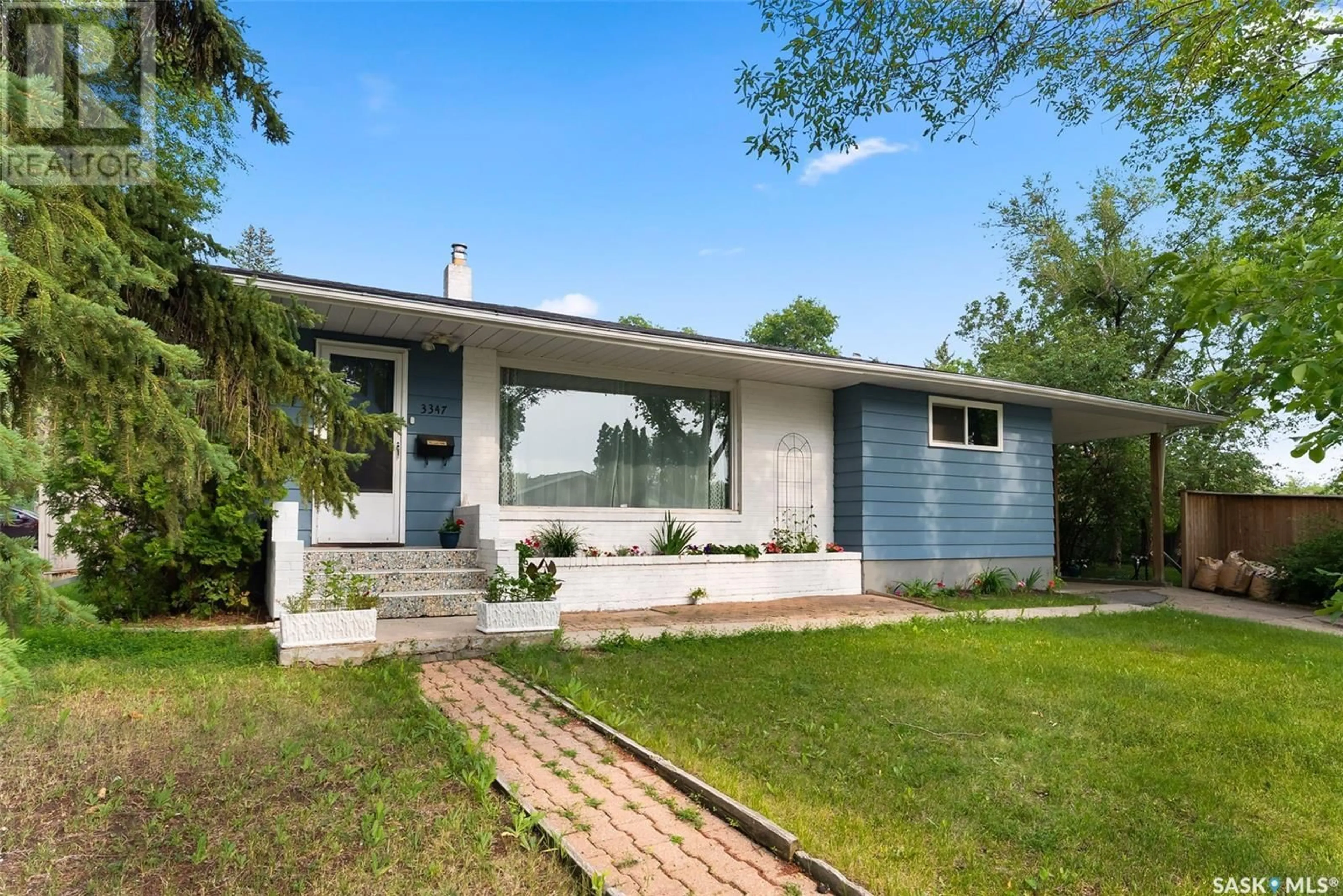 Home with vinyl exterior material, street for 3347 QUEEN STREET, Regina Saskatchewan S4S1B2