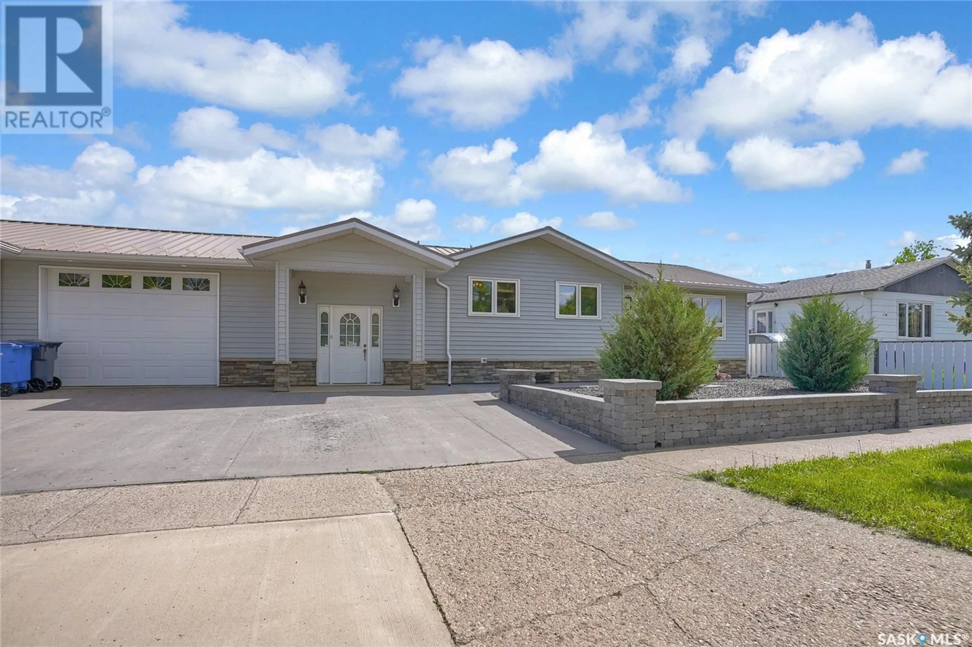 Home with vinyl exterior material, street for 110 3RD AVENUE, Gravelbourg Saskatchewan S0H1X0