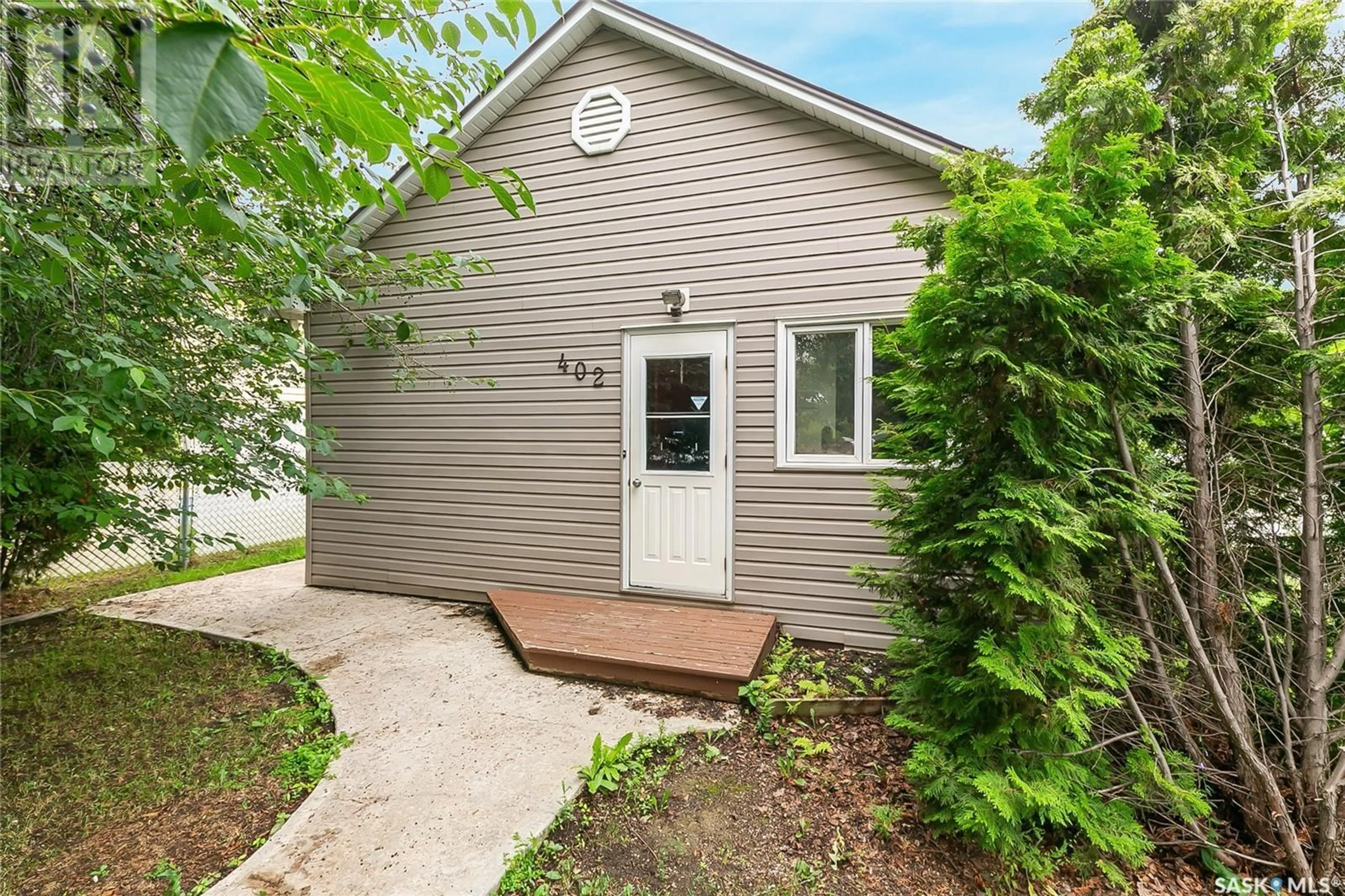 Home with vinyl exterior material, street for 402 FORGET STREET, Regina Saskatchewan S4R4X9