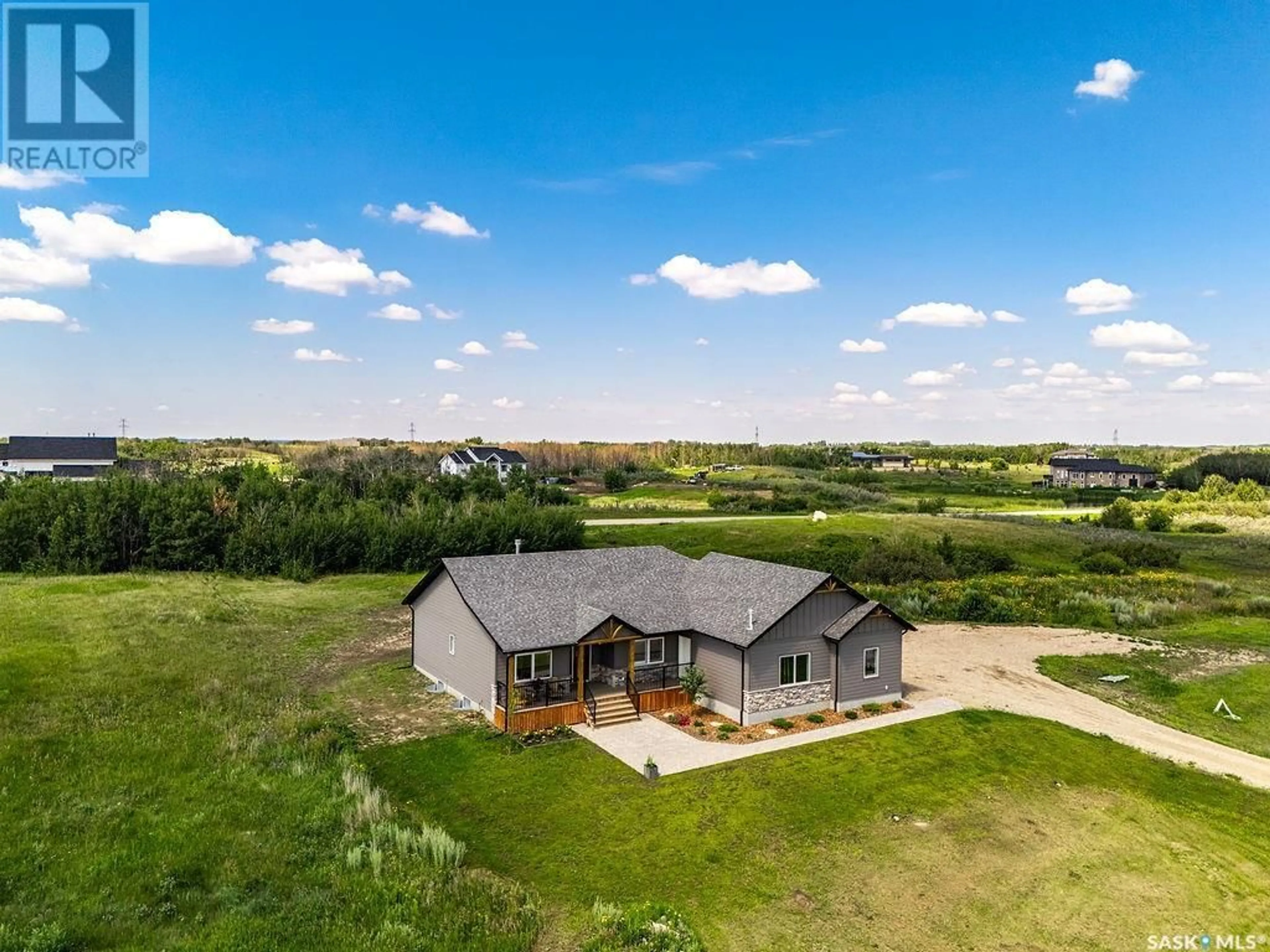 A pic from outside/outdoor area/front of a property/back of a property/a pic from drone, water/lake/river/ocean view for 10 APPLEWOOD PLACE, Corman Park Rm No. 344 Saskatchewan S7V0X4