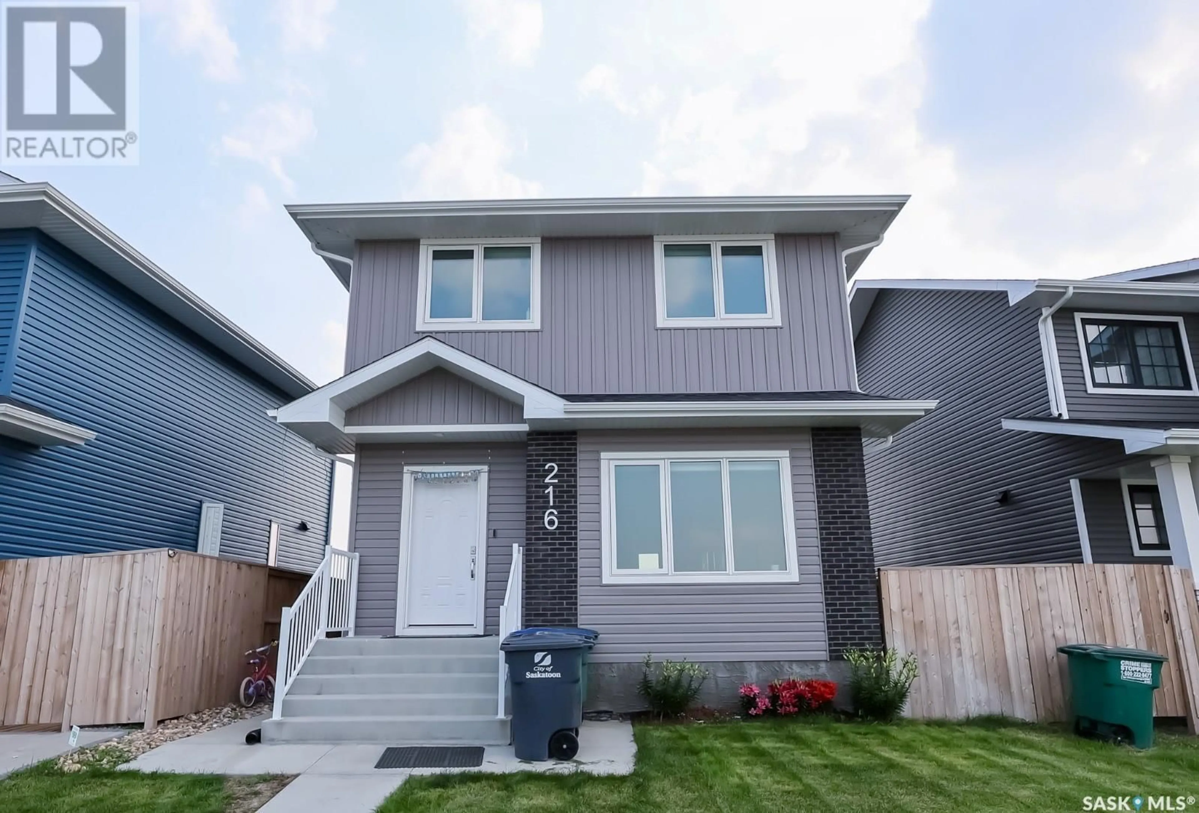 Home with vinyl exterior material, street for 216 ROSEWOOD BOULEVARD, Saskatoon Saskatchewan S7V0X5
