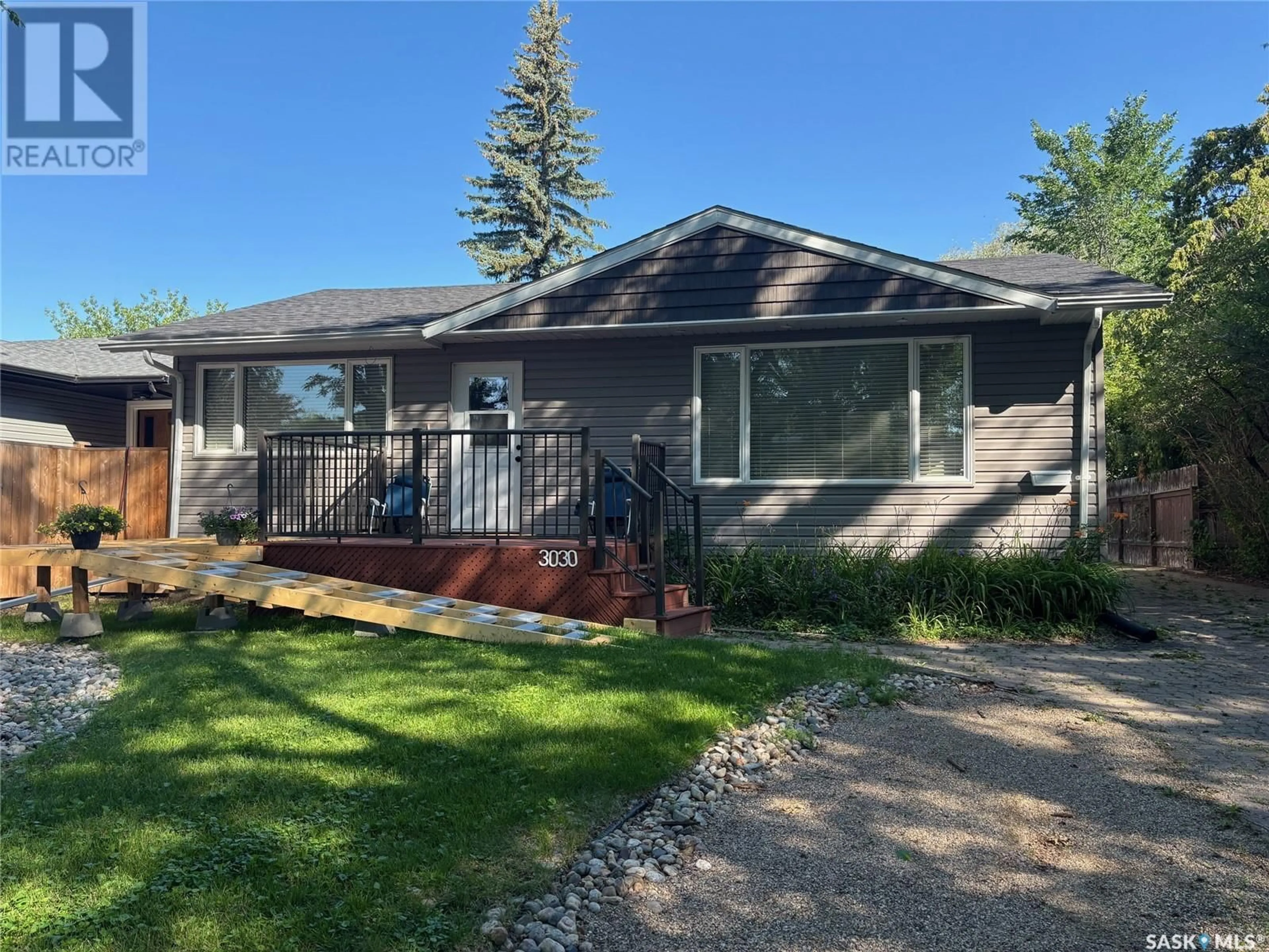 Home with vinyl exterior material, street for 3030 WHITMORE AVENUE, Regina Saskatchewan S4S1B8