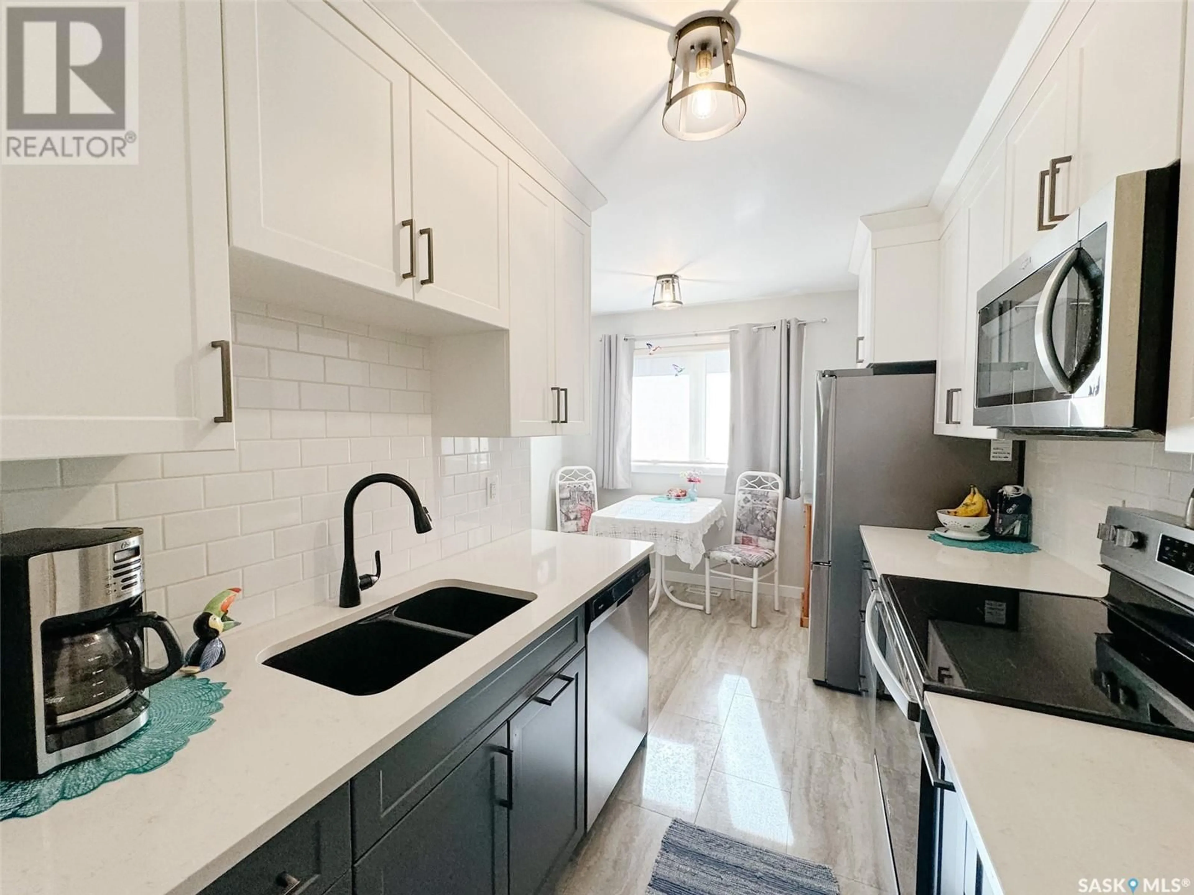 Open concept kitchen, ceramic/tile floor for 4 330 HAIGHT CRESCENT, Saskatoon Saskatchewan S7H4V9