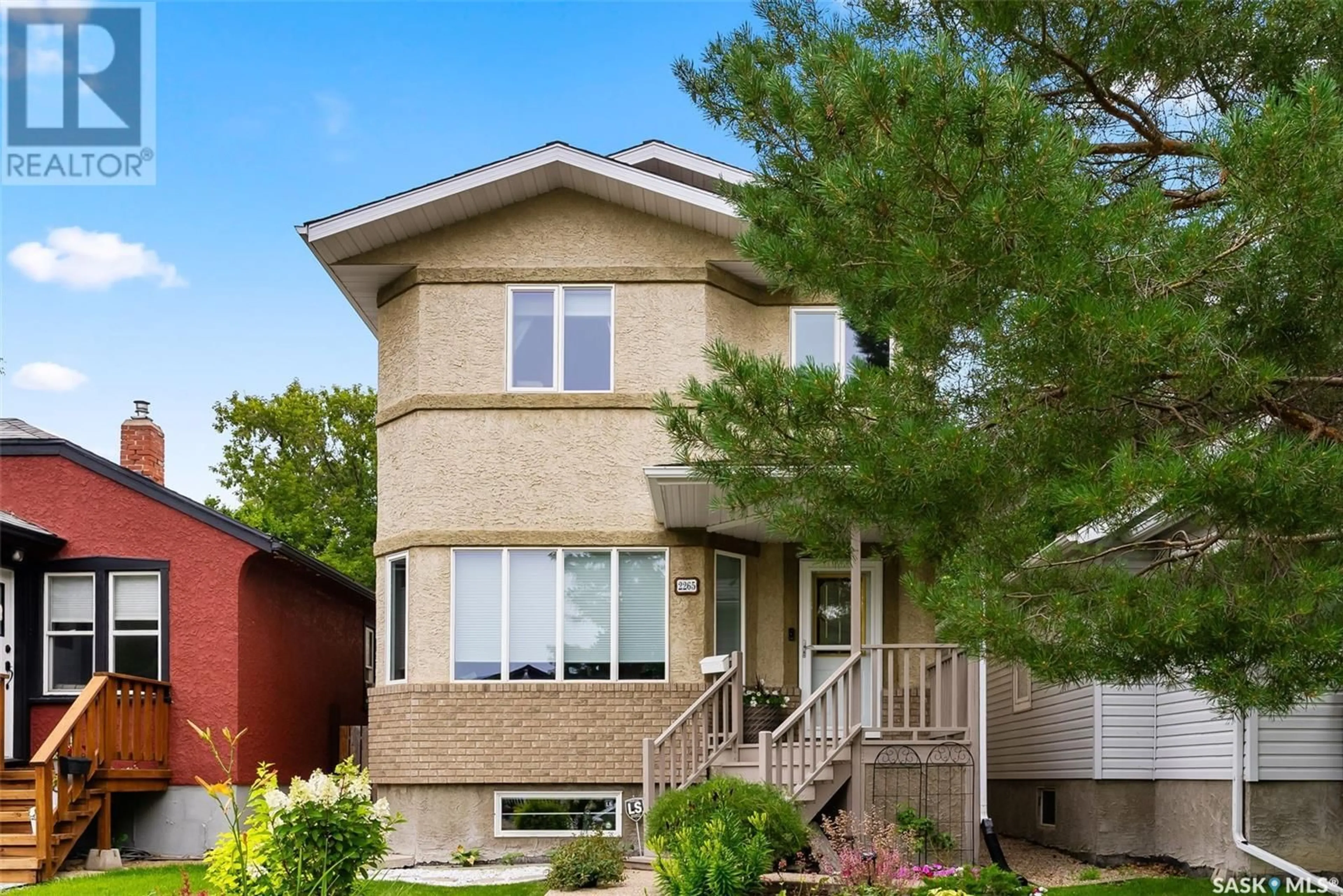 Home with brick exterior material, street for 2265 QUEEN STREET, Regina Saskatchewan S4T4C6