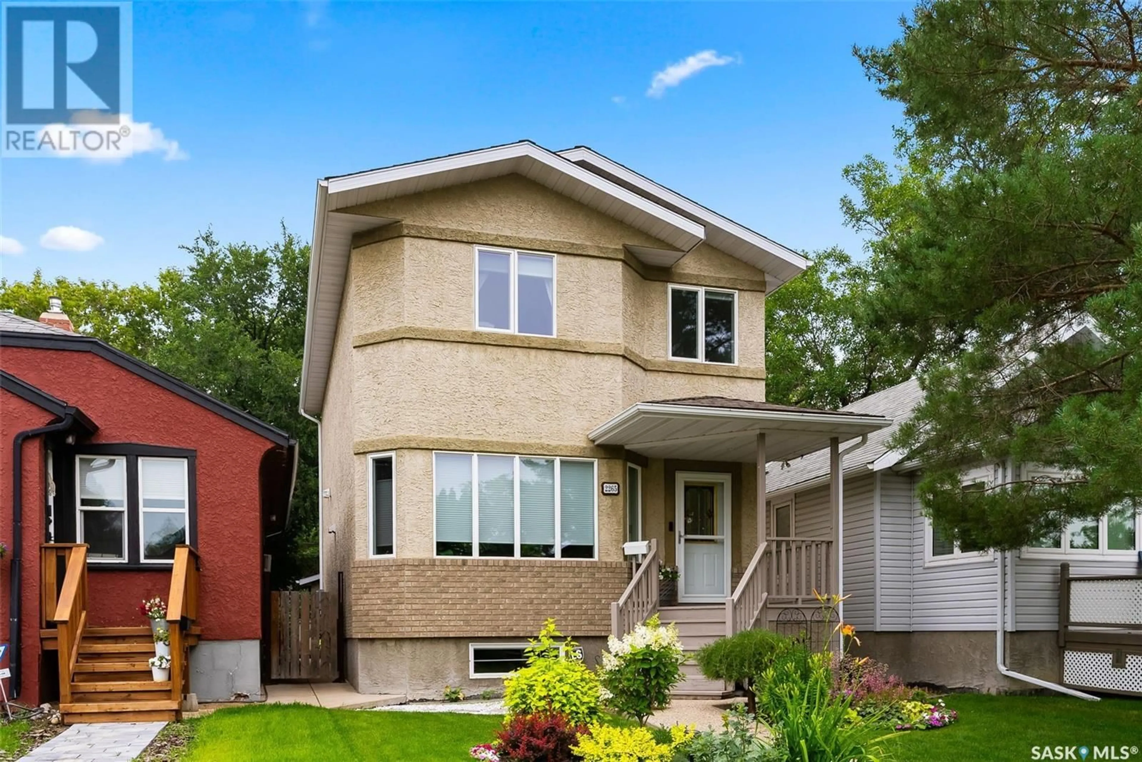 Home with vinyl exterior material, street for 2265 QUEEN STREET, Regina Saskatchewan S4T4C6