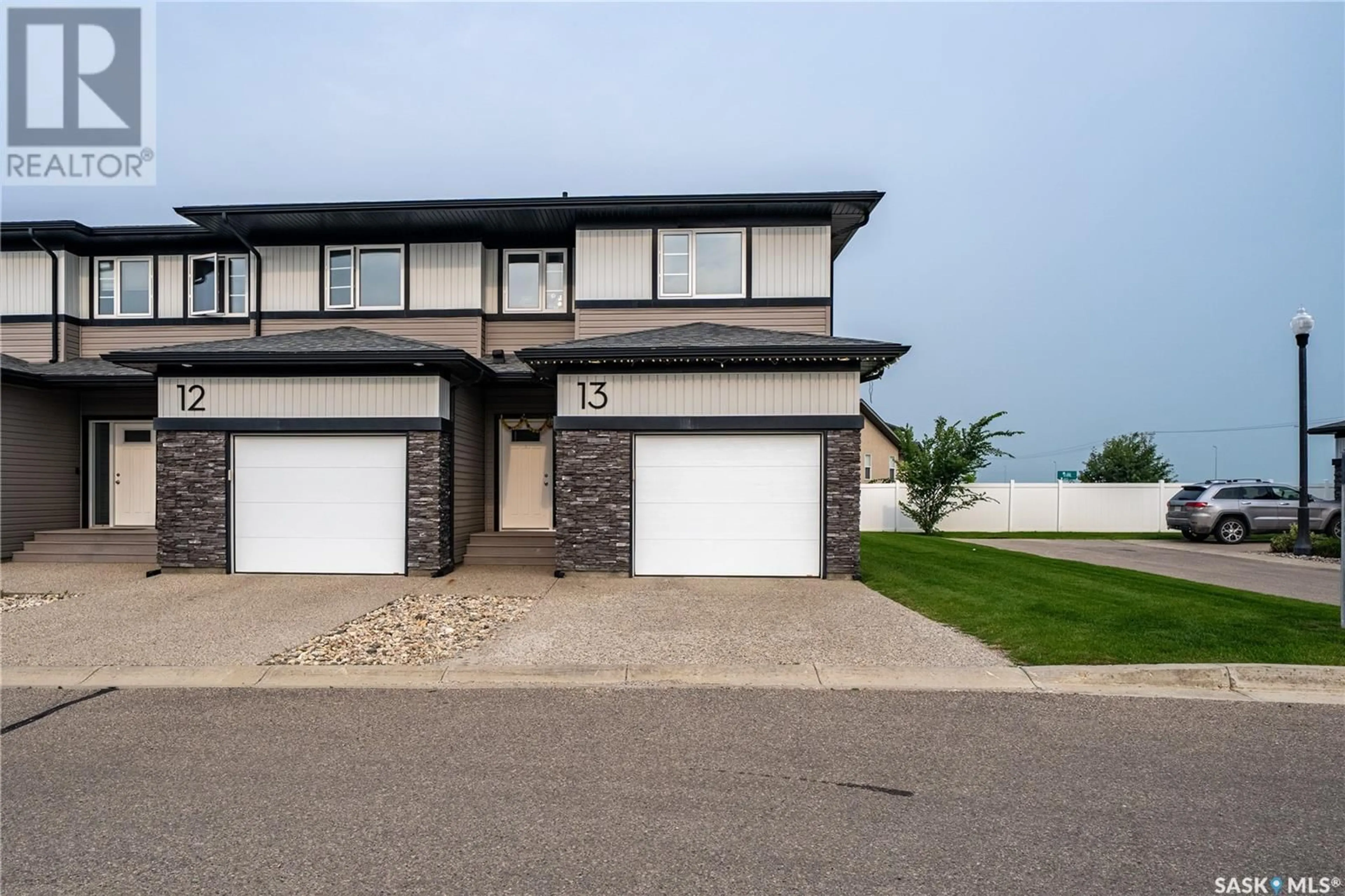 Home with vinyl exterior material, street for 13 5301 BEACON DRIVE, Regina Saskatchewan S4W0R6