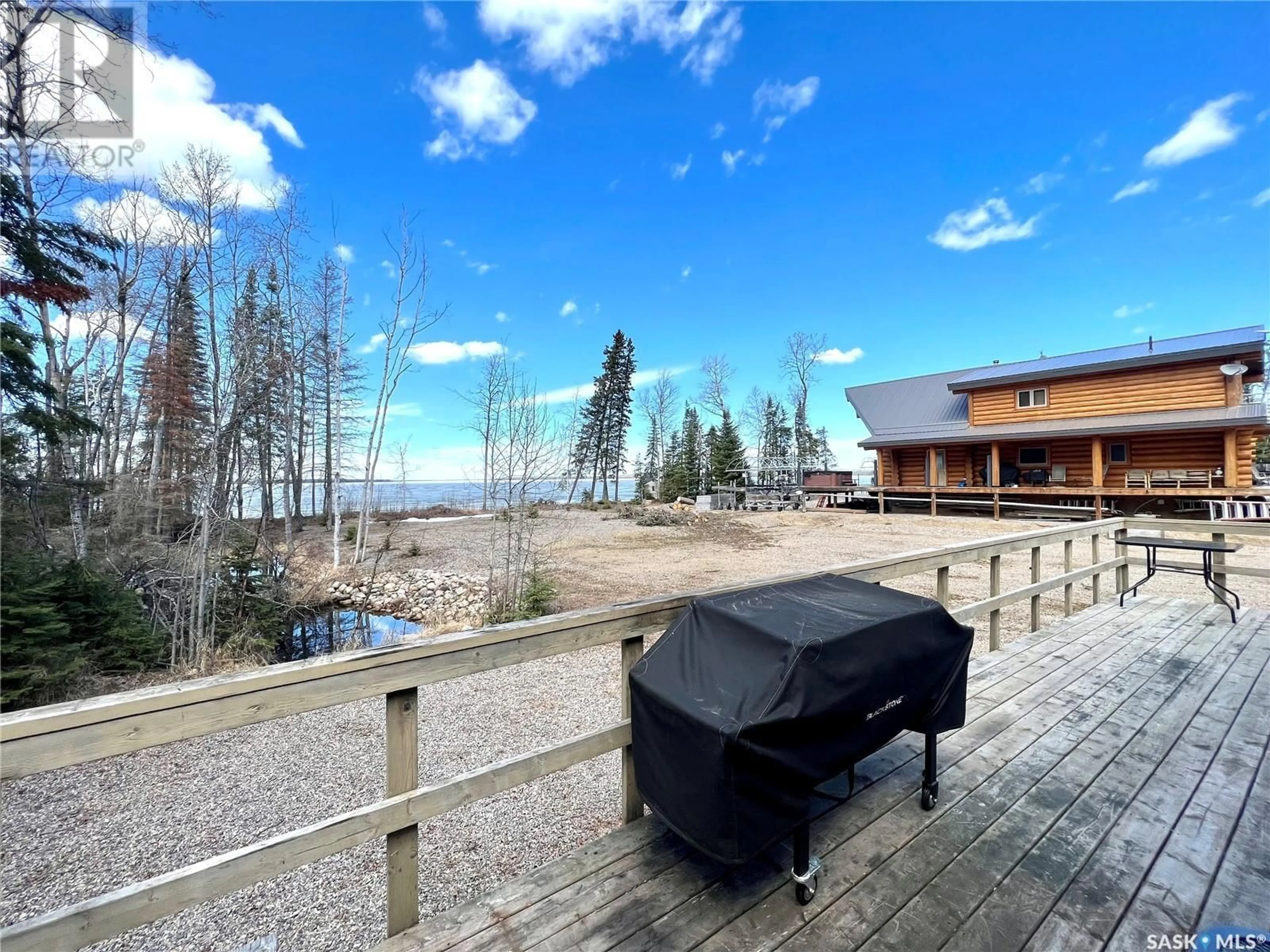 A pic from outside/outdoor area/front of a property/back of a property/a pic from drone, water/lake/river/ocean view for 507 LAKEVIEW AVENUE, Northern Admin District Saskatchewan S0J1L0