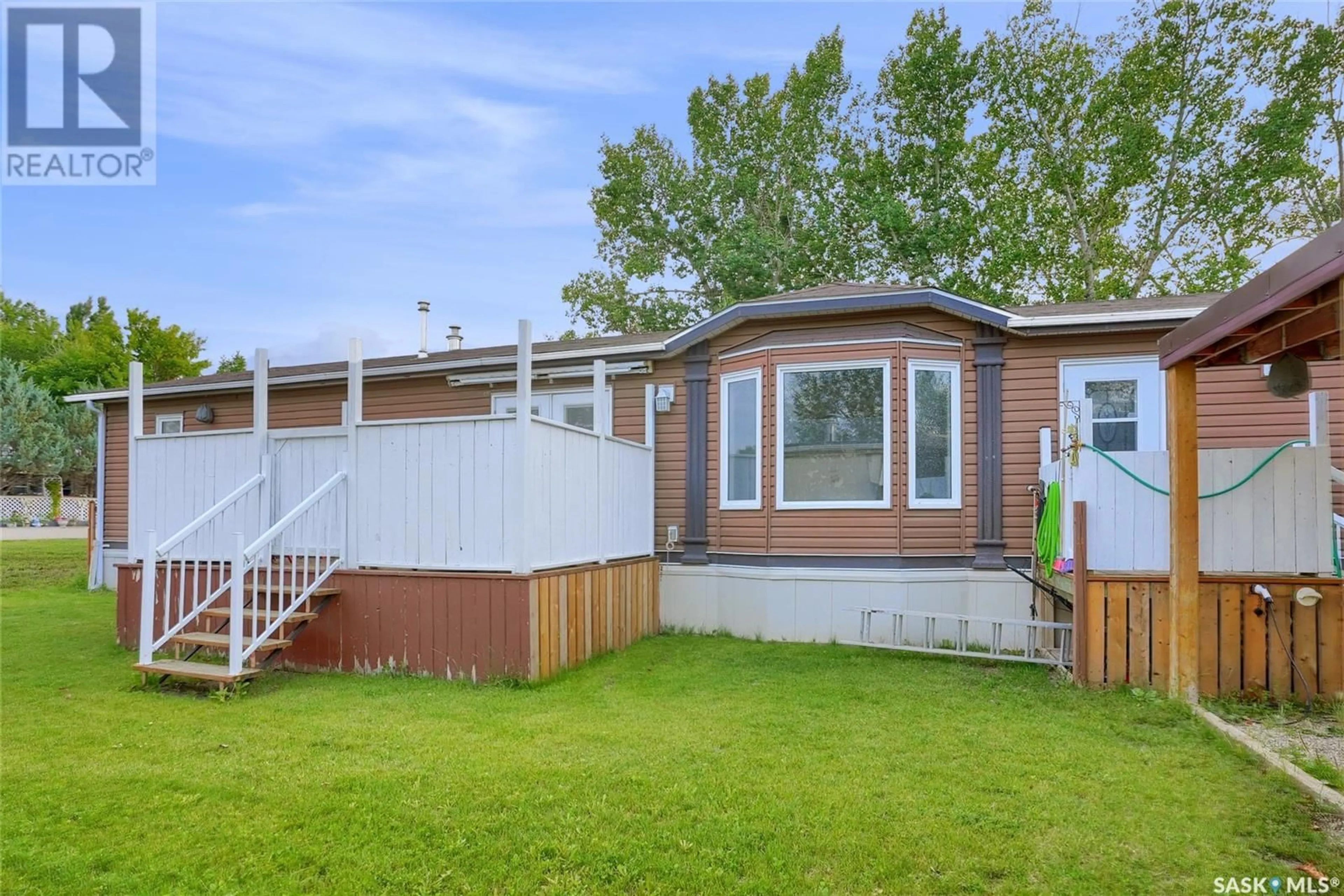 Home with vinyl exterior material, street for F3 - 1455 9TH AVENUE, Moose Jaw Saskatchewan S6J1C6