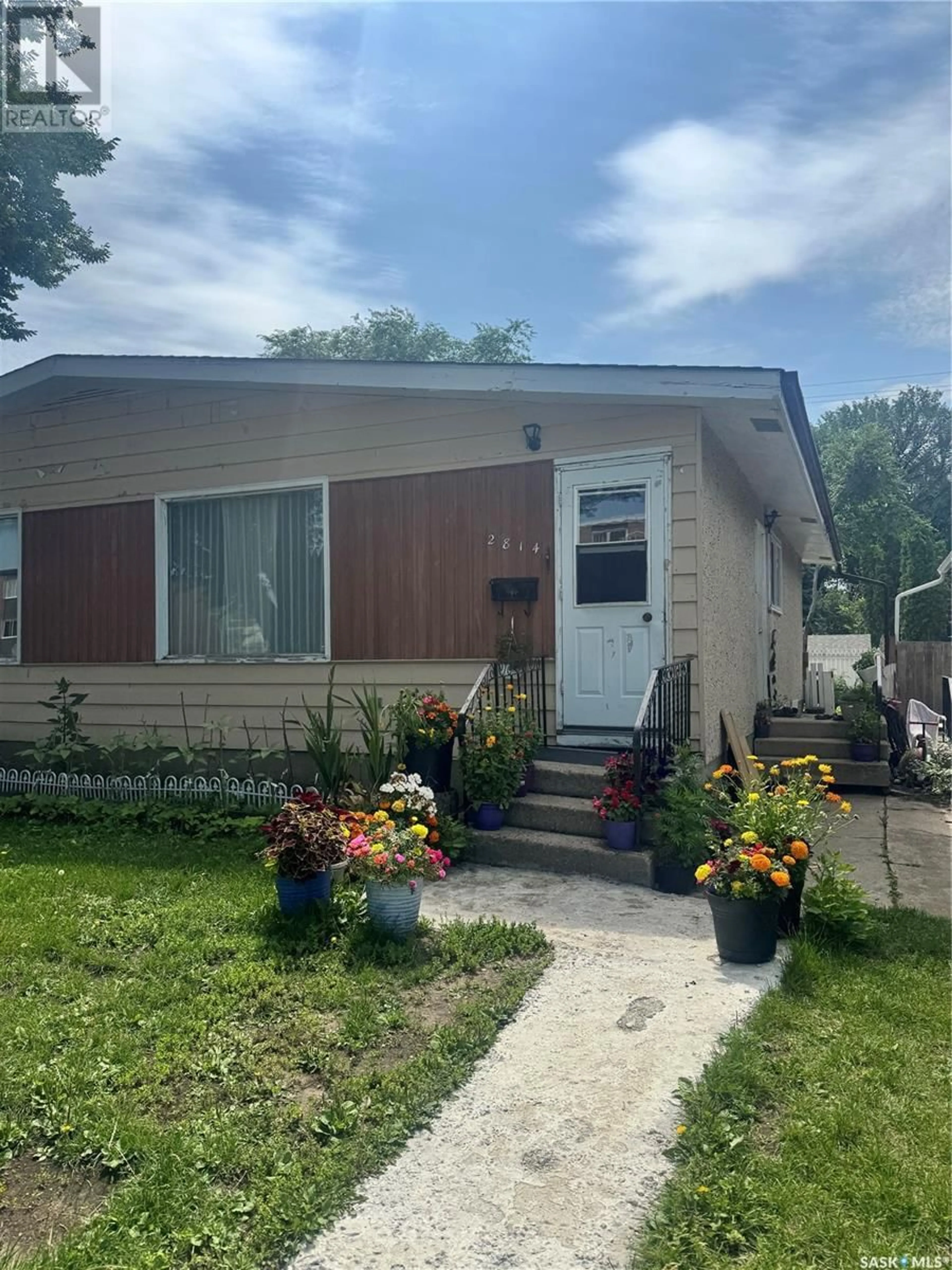 Home with vinyl exterior material, street for 2816 7TH STREET, Saskatoon Saskatchewan S7H1B3