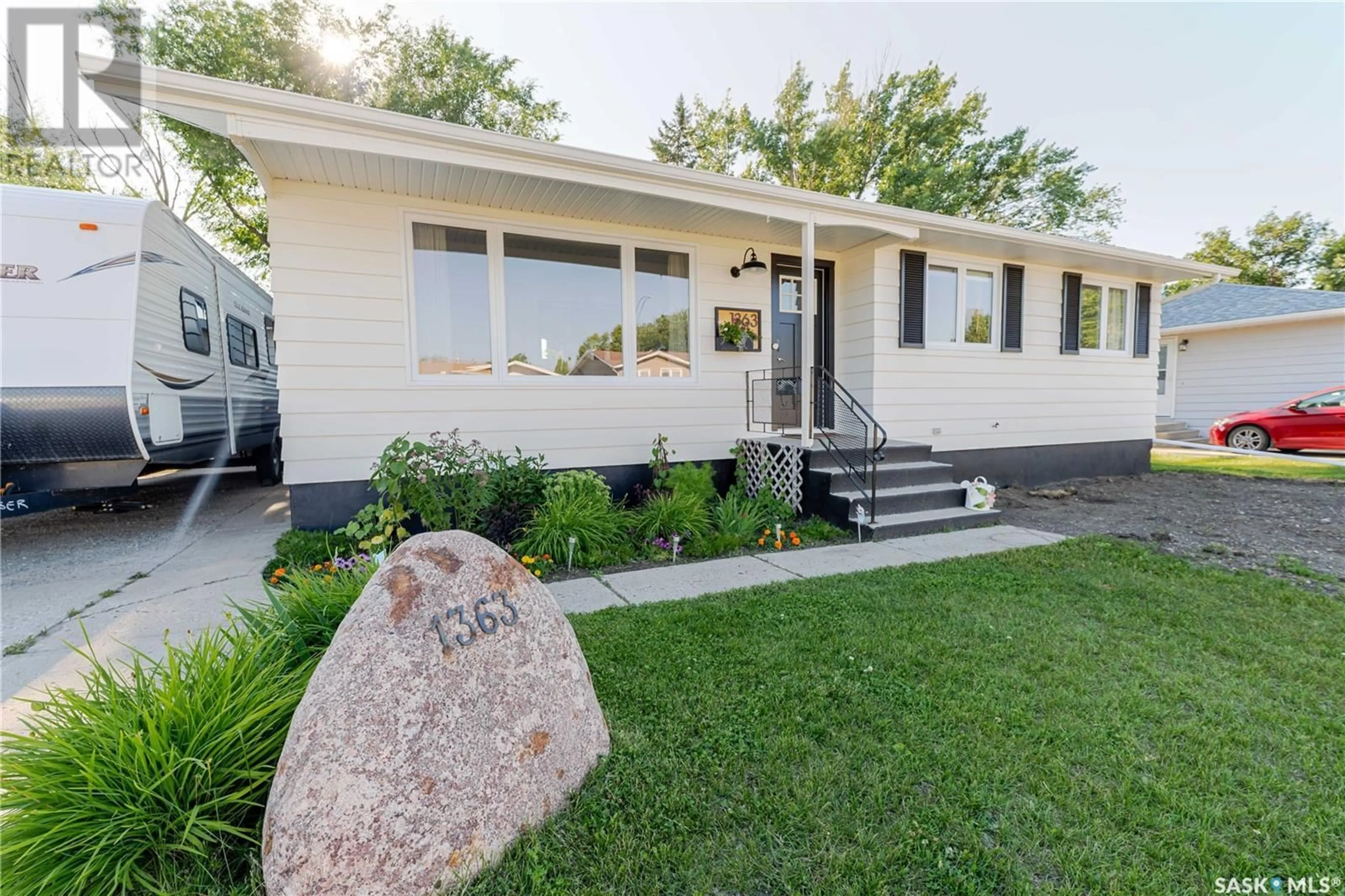 Home with vinyl exterior material, street for 1363 QUEEN CRESCENT, Moose Jaw Saskatchewan S6H3G5