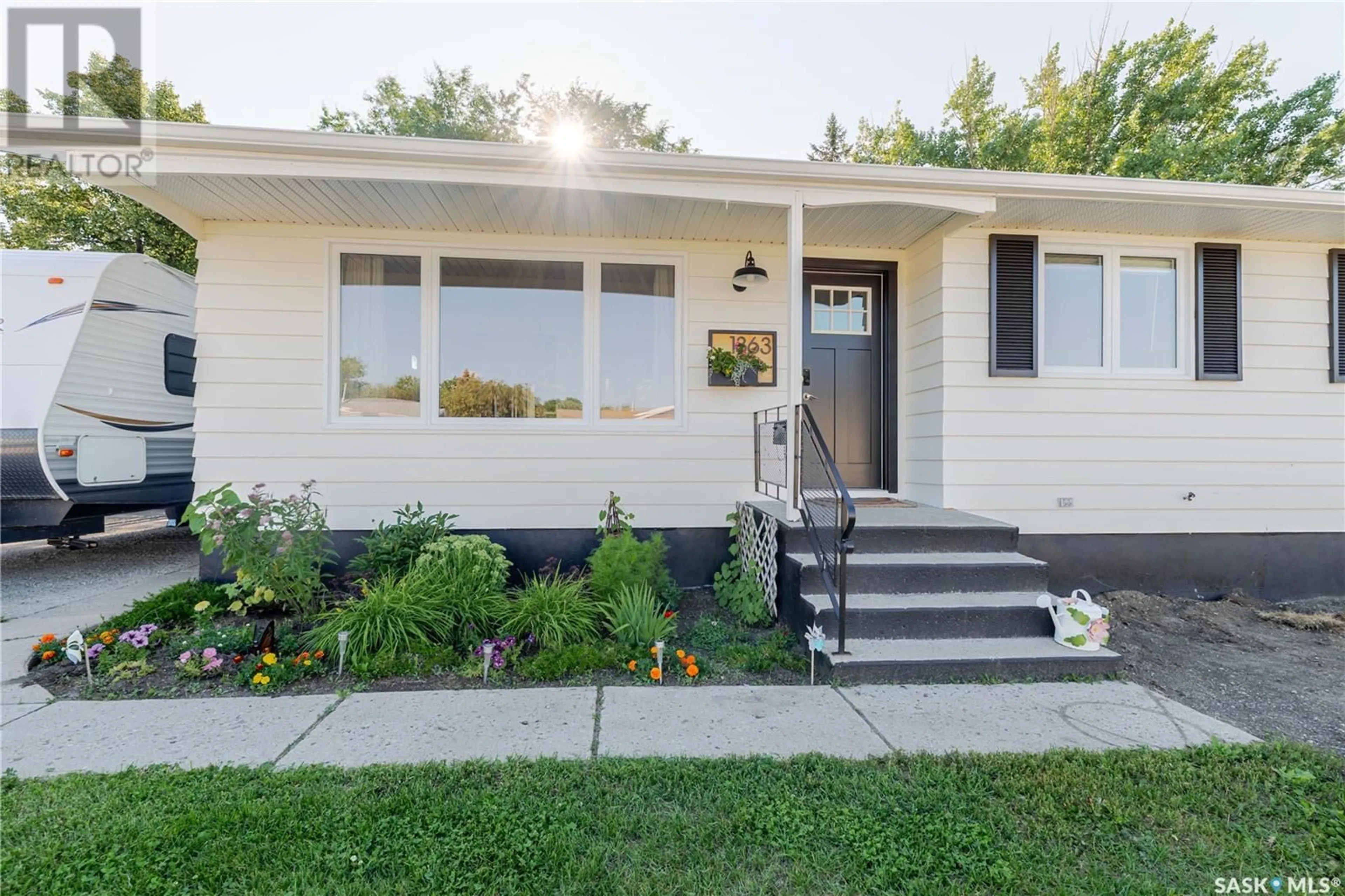 Home with vinyl exterior material, street for 1363 QUEEN CRESCENT, Moose Jaw Saskatchewan S6H3G5