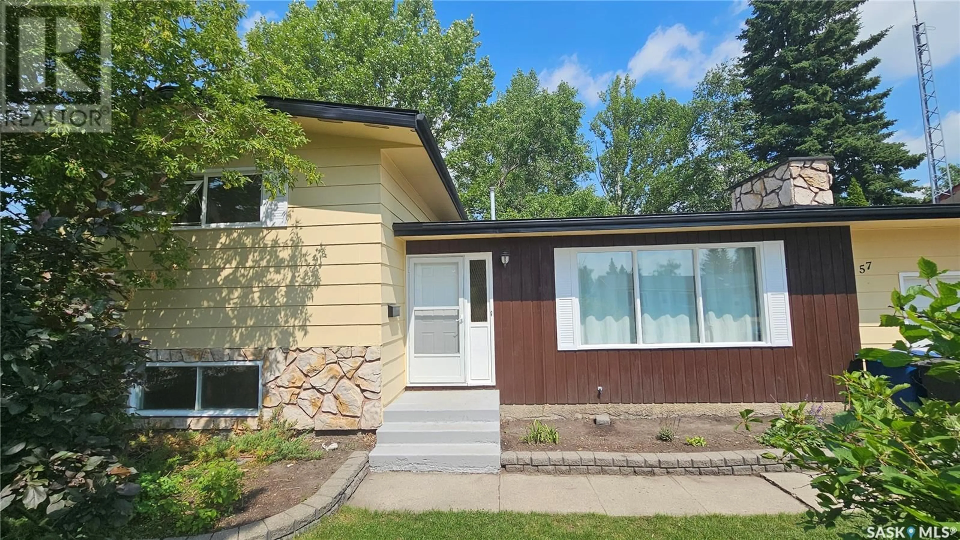 Home with vinyl exterior material, street for 57 JUBILEE DRIVE, Humboldt Saskatchewan S0K2A0