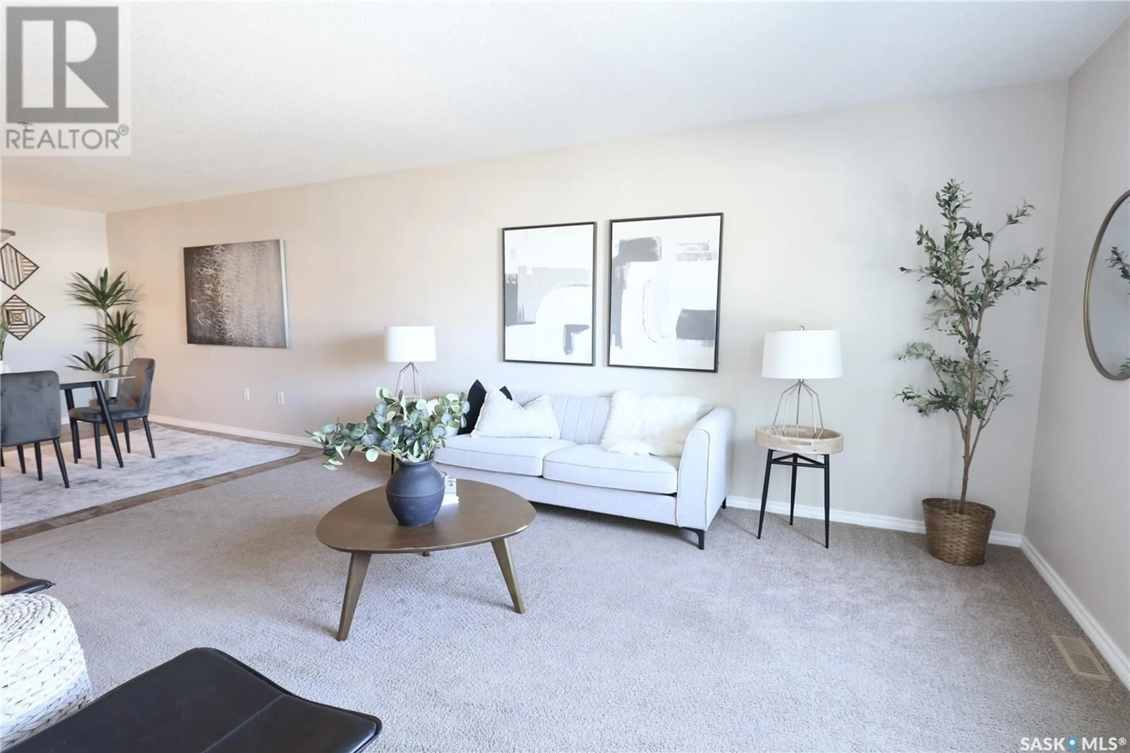 Living room with furniture, carpet floor for 103 - 6345 ROCHDALE BOULEVARD, Regina Saskatchewan S4X2R1