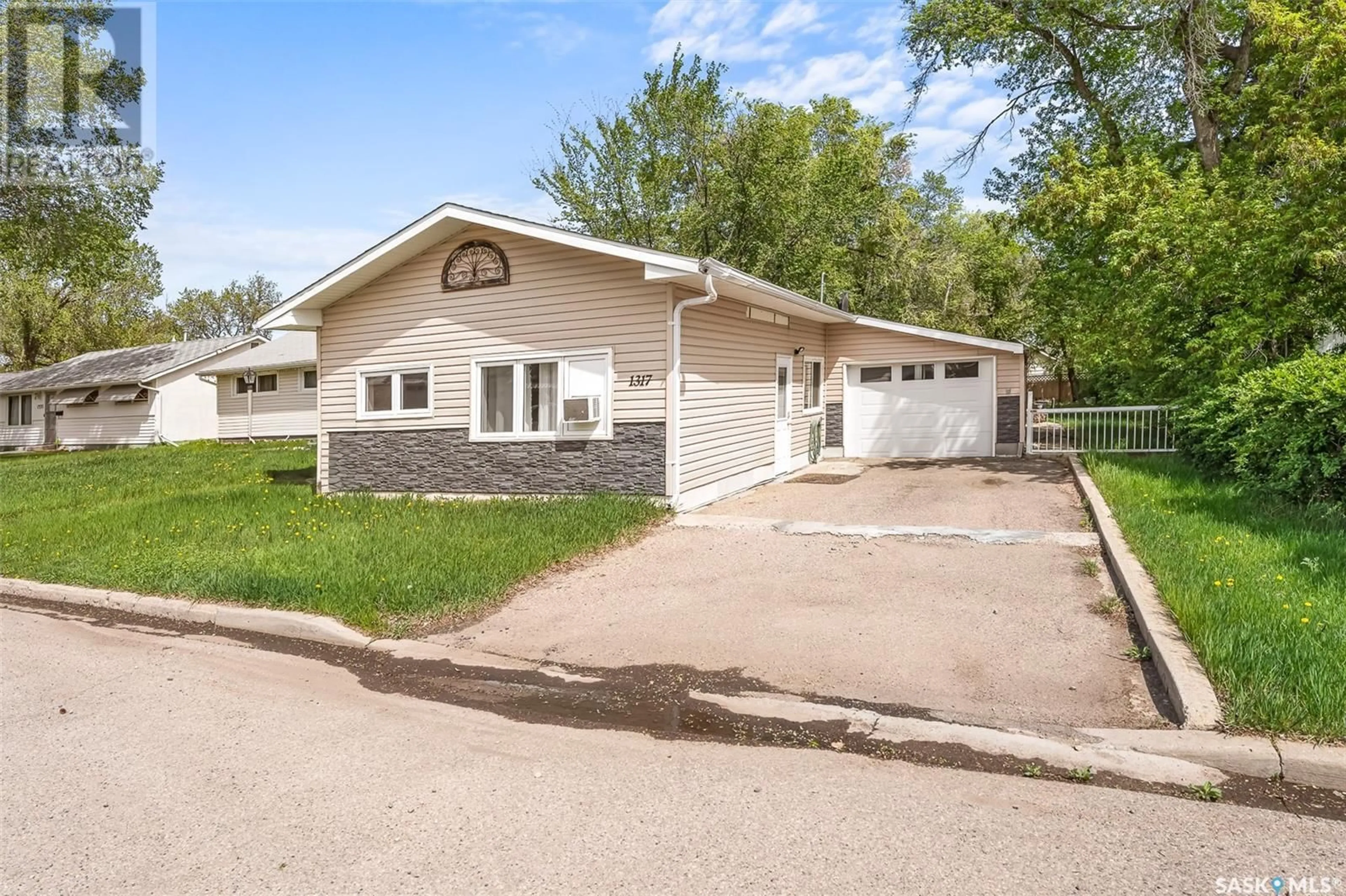 Home with vinyl exterior material, street for 1317 CONNAUGHT AVENUE, Moose Jaw Saskatchewan S6H4B9
