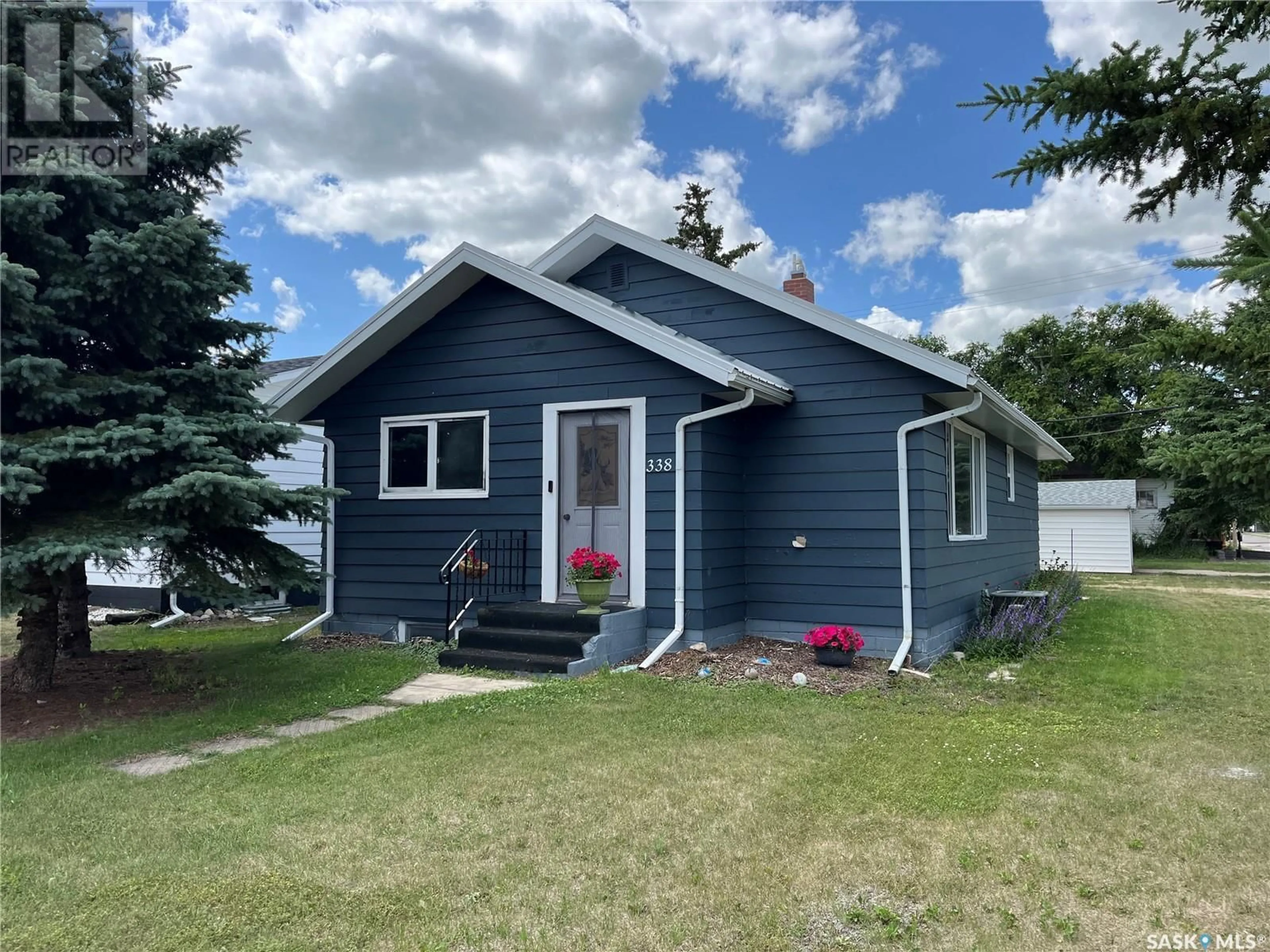 Home with vinyl exterior material, street for 338 FORGET STREET, Foam Lake Saskatchewan S0A1A0