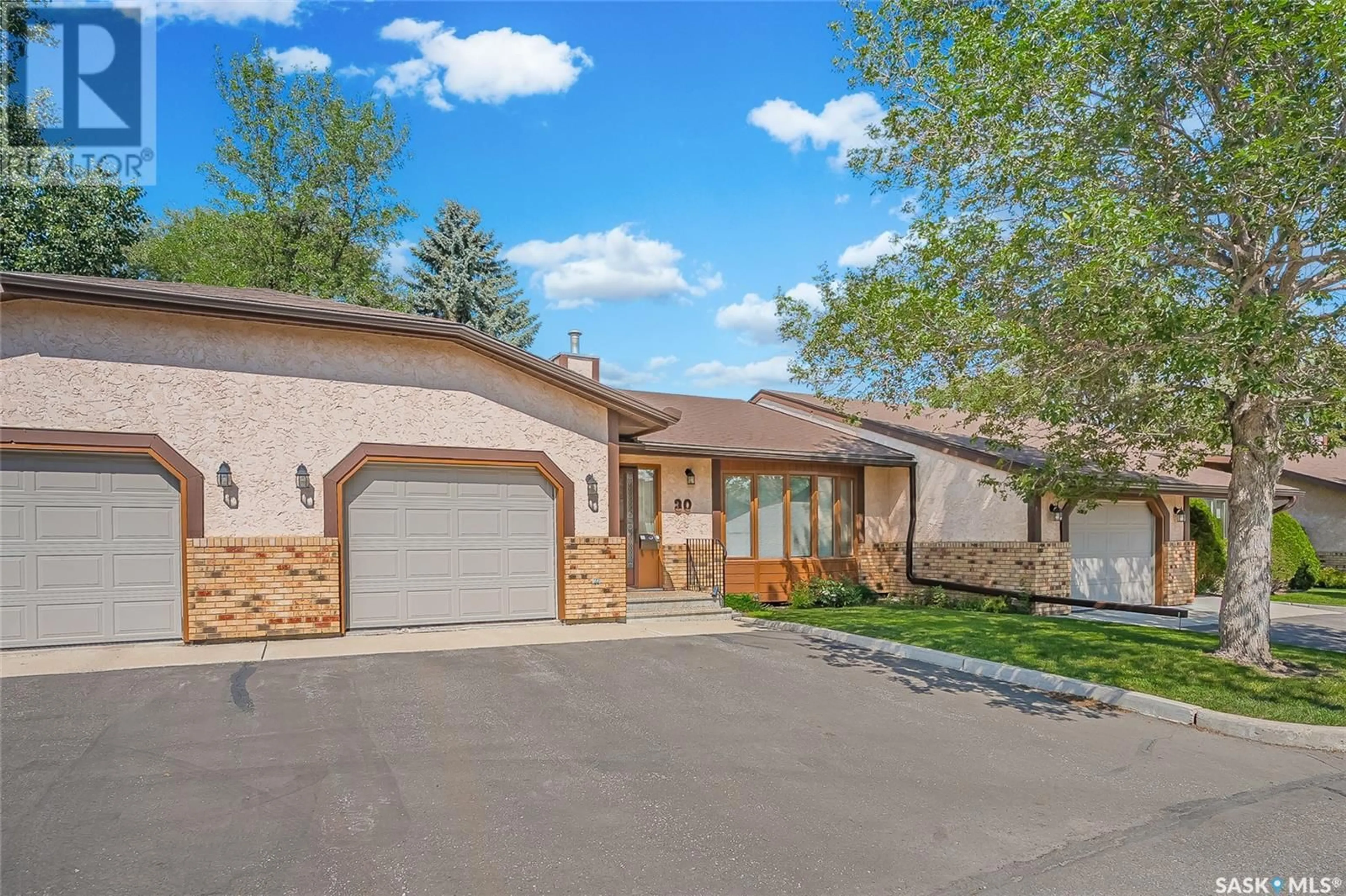 Home with vinyl exterior material, street for 30 - 310 KINGSMERE BOULEVARD, Saskatoon Saskatchewan S7J4S4