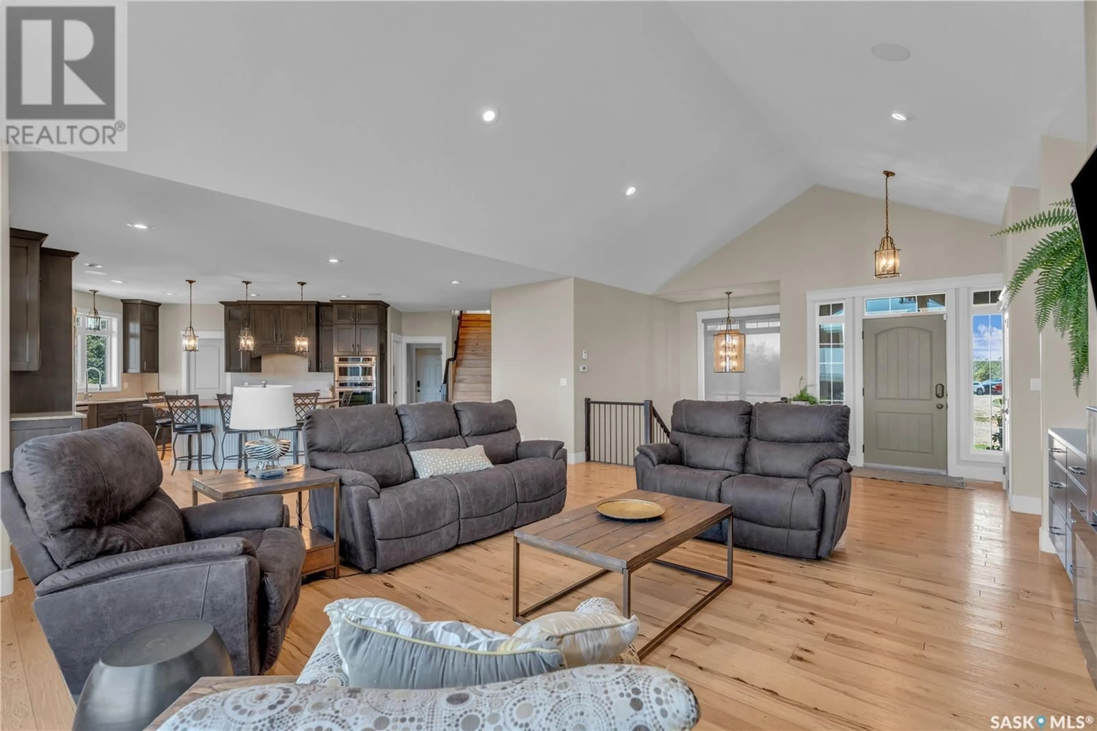 Living room with furniture, wood/laminate floor for 111 PRAIRIE DRIVE, Aberdeen Rm No. 373 Saskatchewan S7A0A1