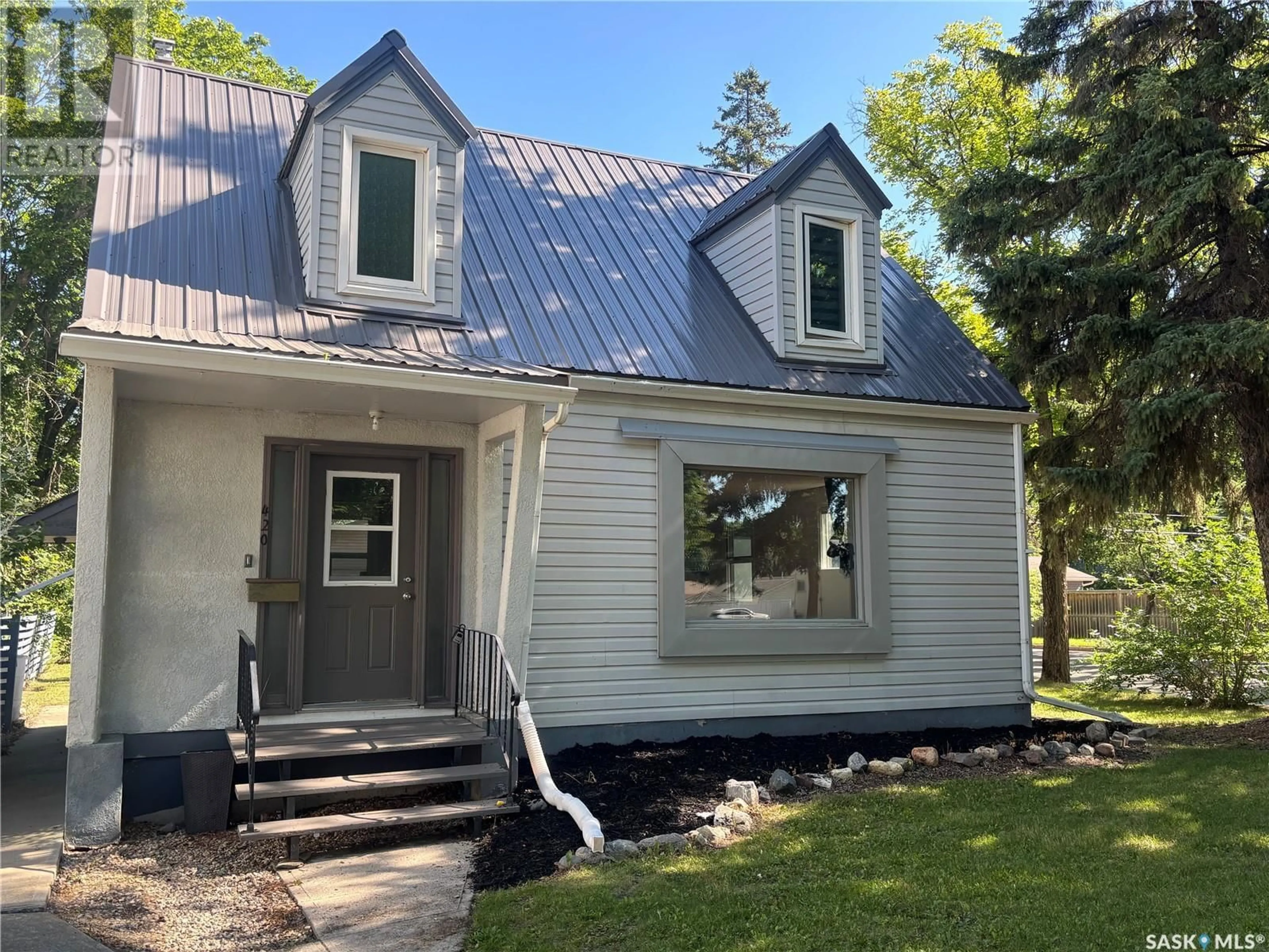 Home with vinyl exterior material, street for 420 MACLEOD AVENUE, Melfort Saskatchewan S0E1A0