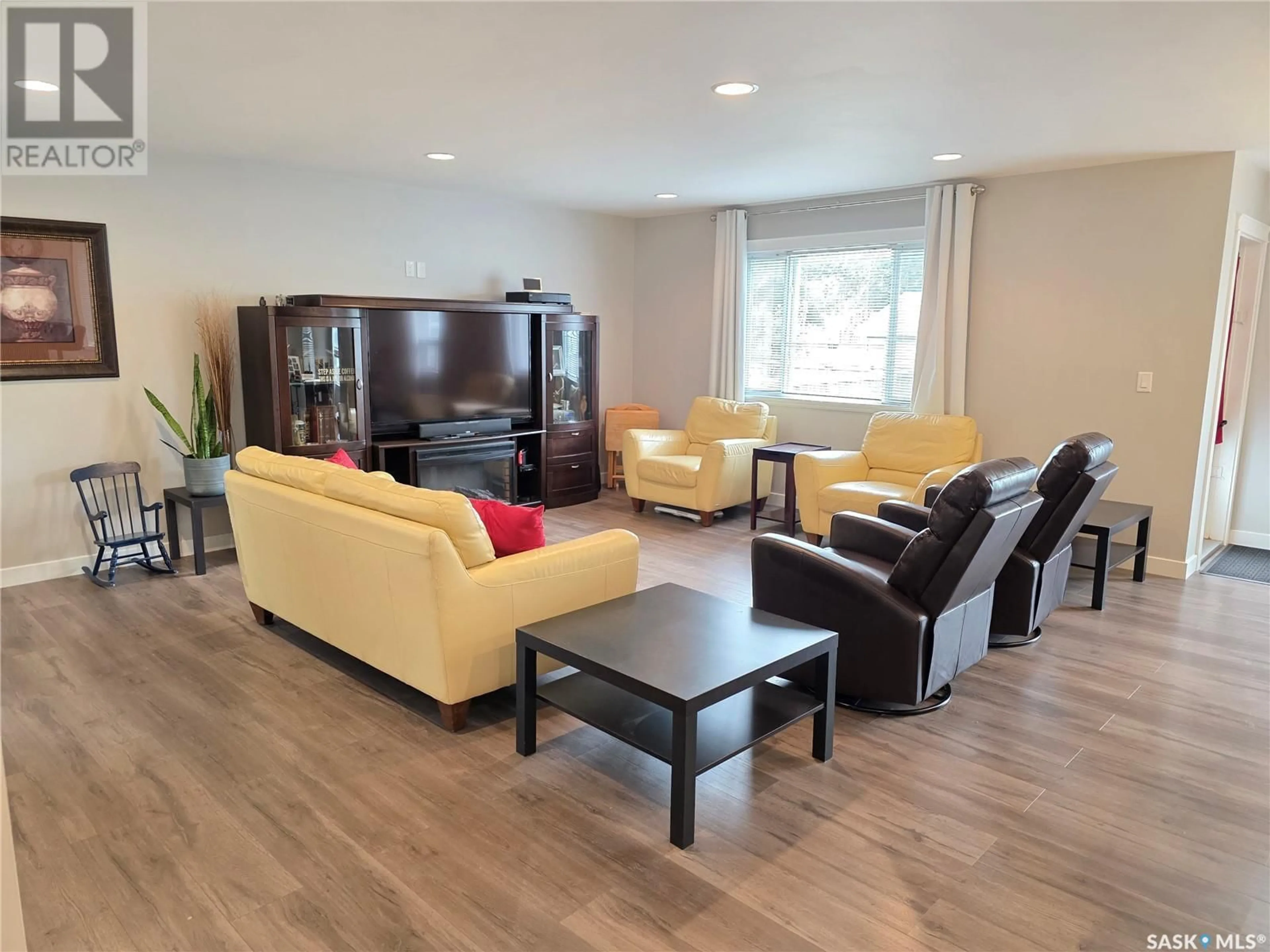 Living room with furniture, wood/laminate floor for 328 MCTAVISH STREET, Outlook Saskatchewan S0L2N0