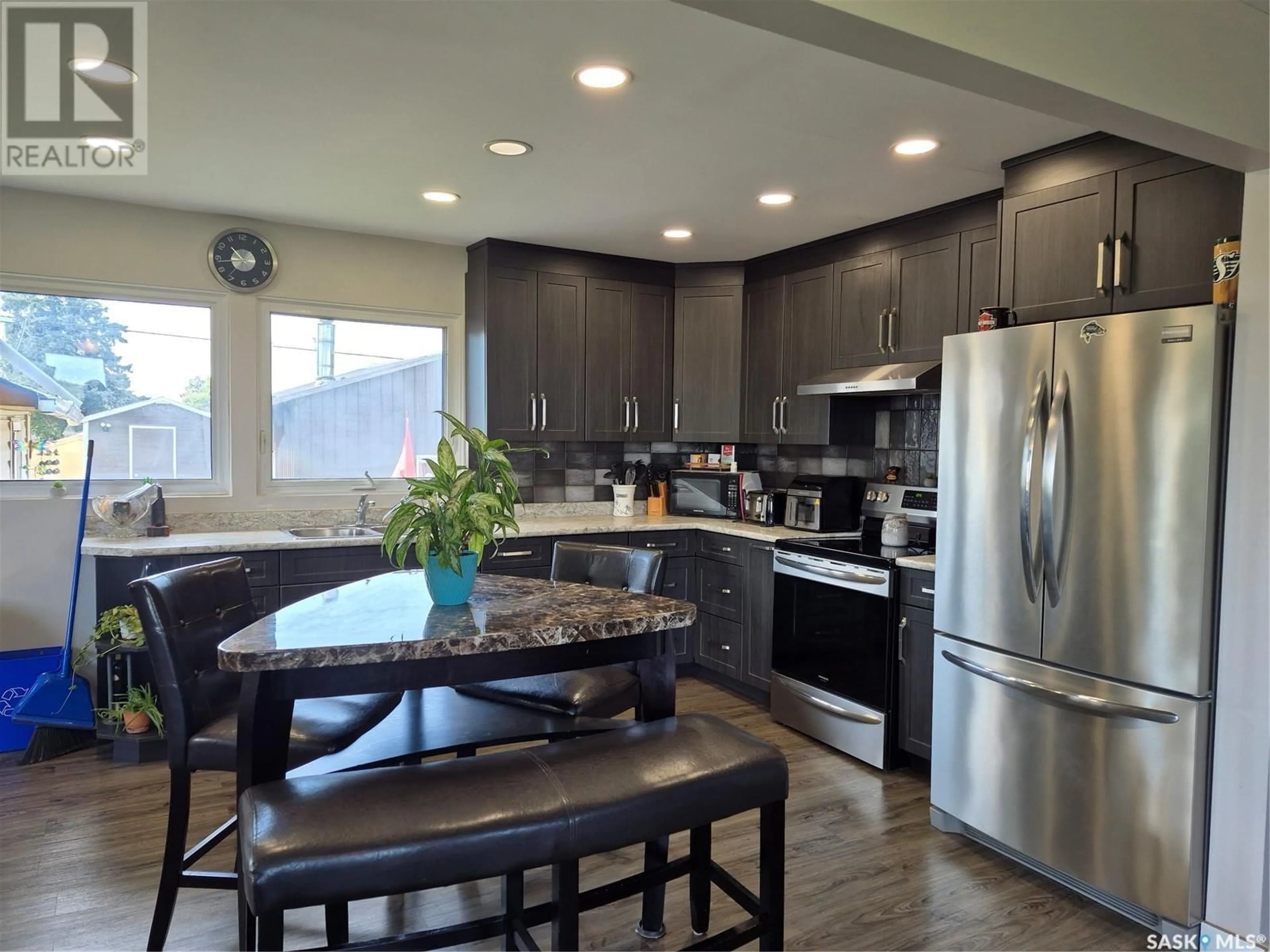 Open concept kitchen, wood/laminate floor for 111 RAILWAY AVENUE, Hafford Saskatchewan S0J1A0