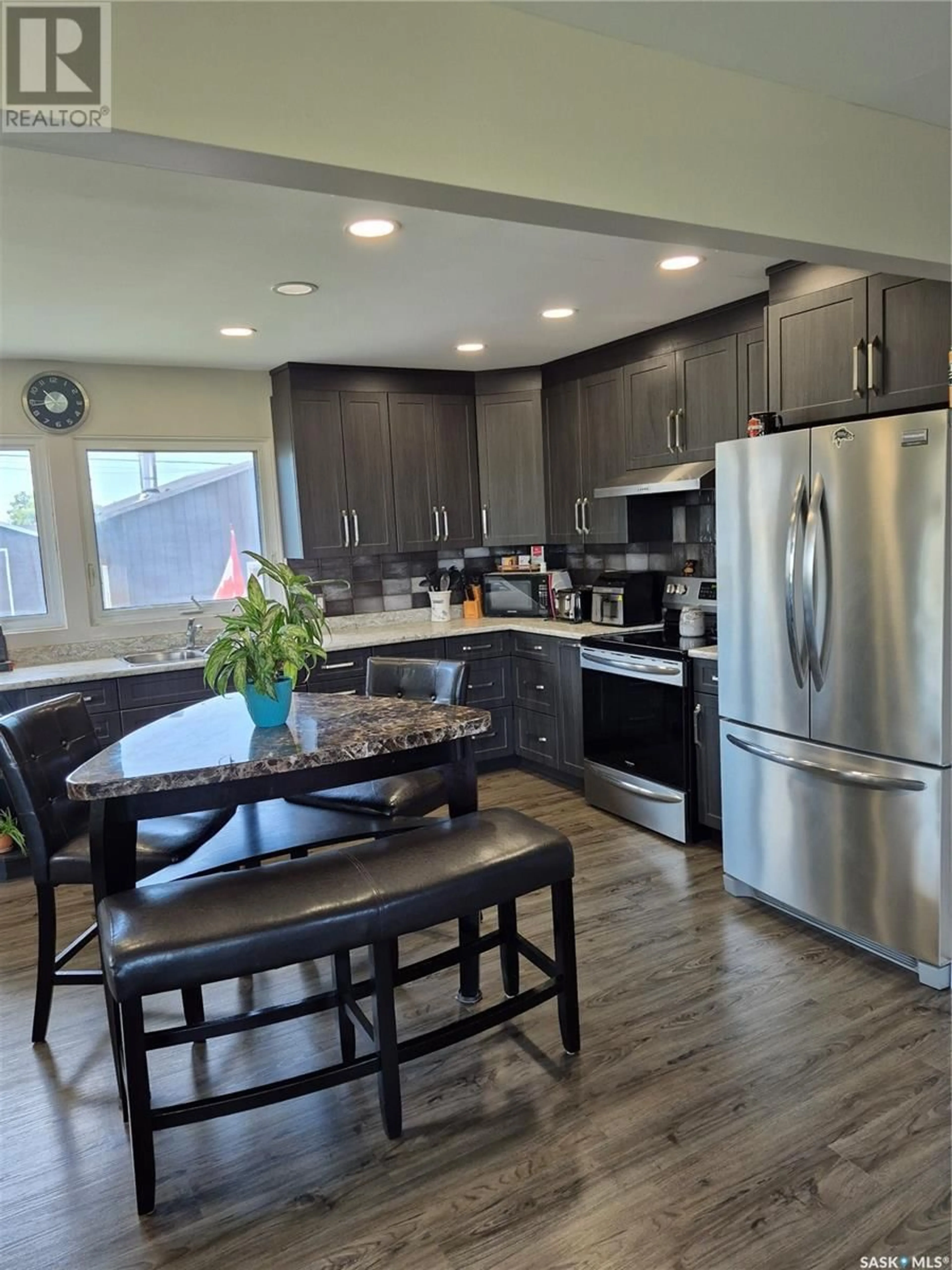 Open concept kitchen, wood/laminate floor for 111 RAILWAY AVENUE, Hafford Saskatchewan S0J1A0