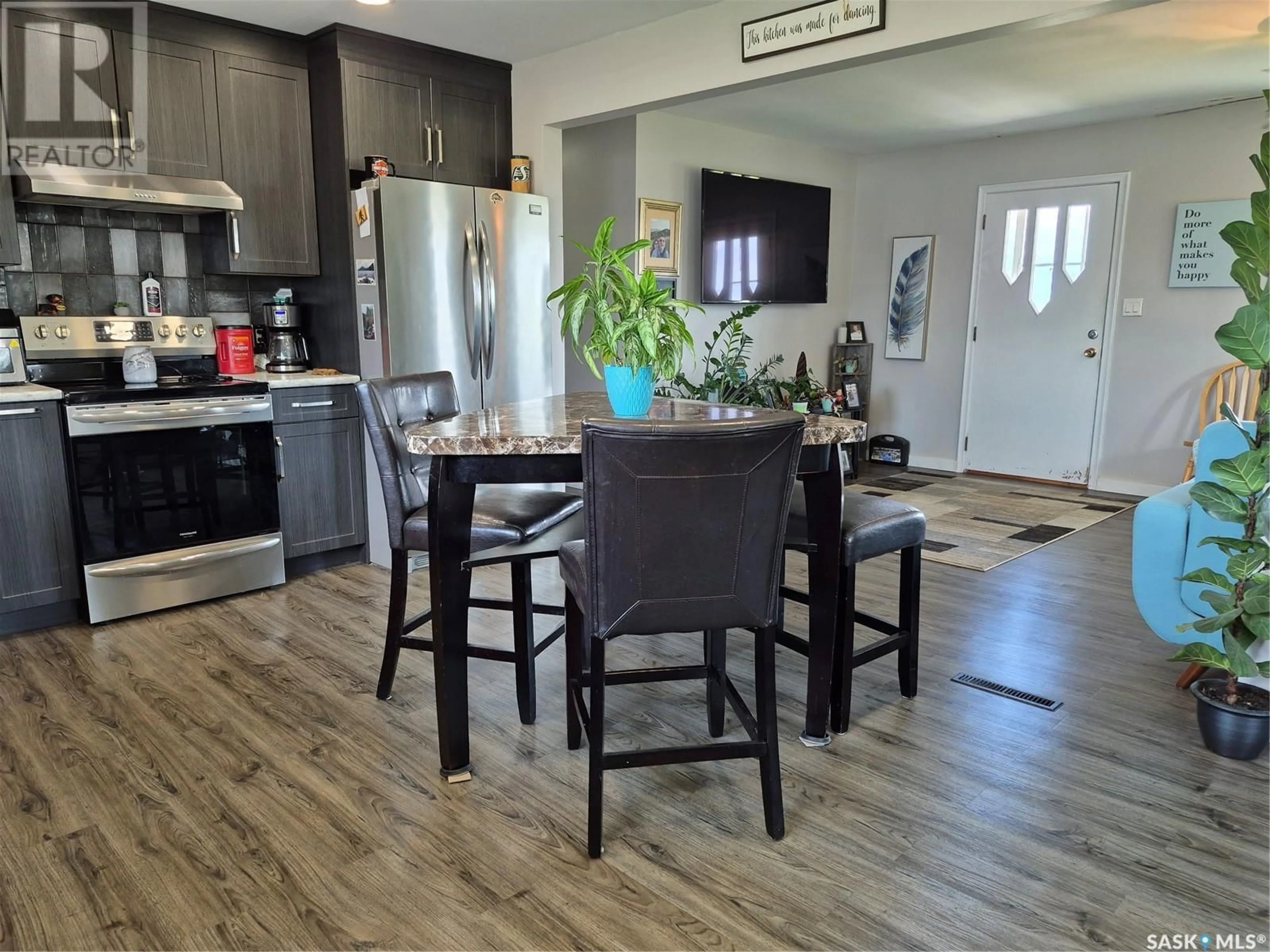 Open concept kitchen, wood/laminate floor for 111 RAILWAY AVENUE, Hafford Saskatchewan S0J1A0
