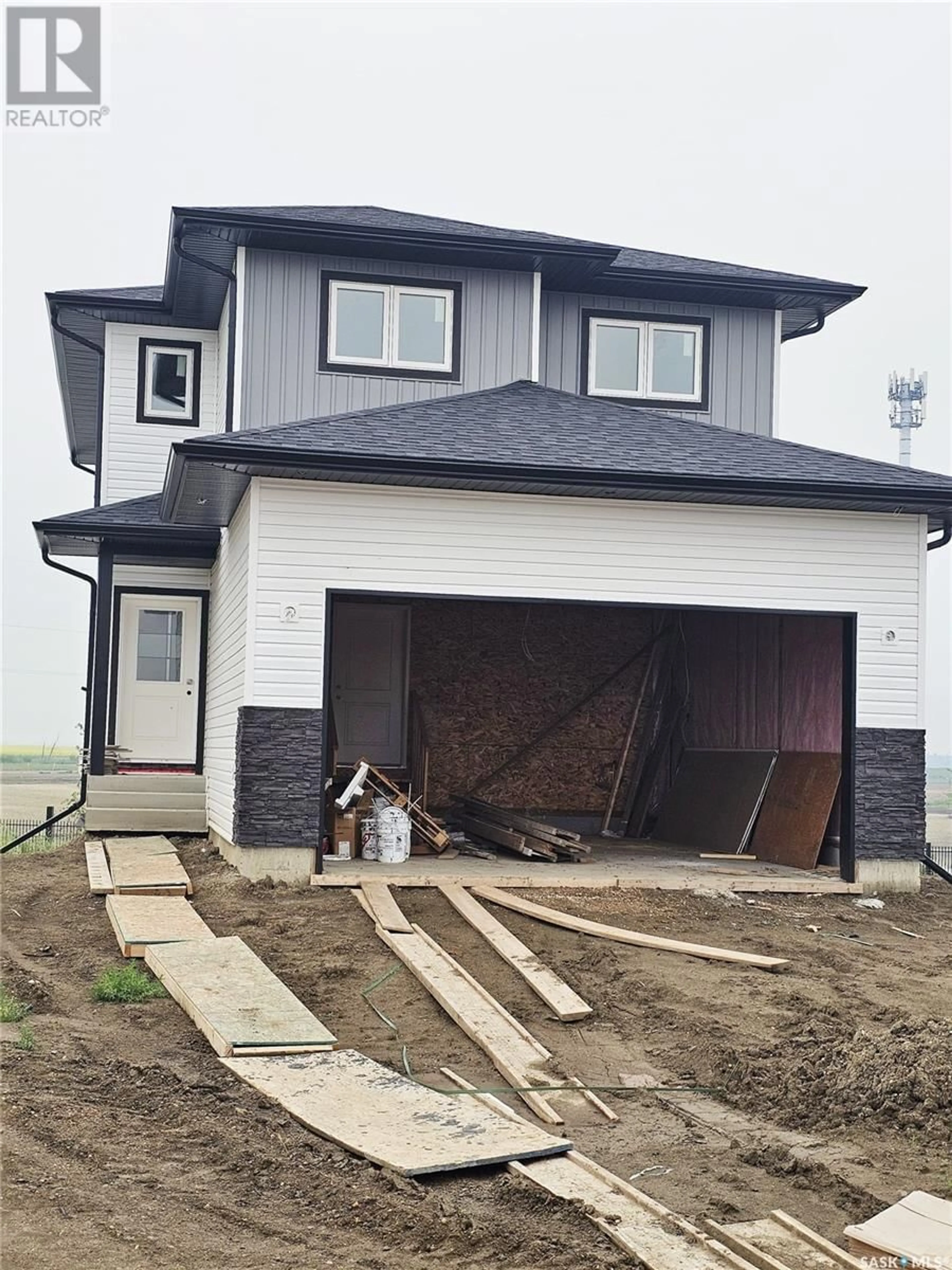 Home with vinyl exterior material, street for 157 ANTONINI COURT, Saskatoon Saskatchewan S7R0M3