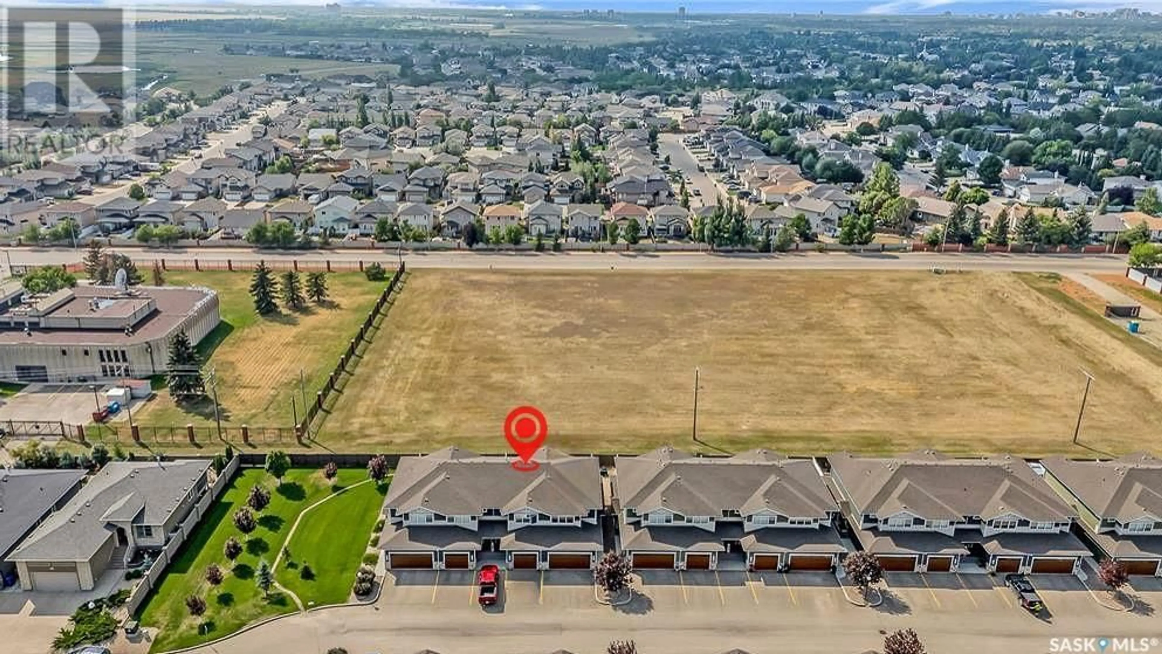 A pic from outside/outdoor area/front of a property/back of a property/a pic from drone, unknown for 303 - 4000 SANDHILL CRESCENT, Regina Saskatchewan S4V3N4